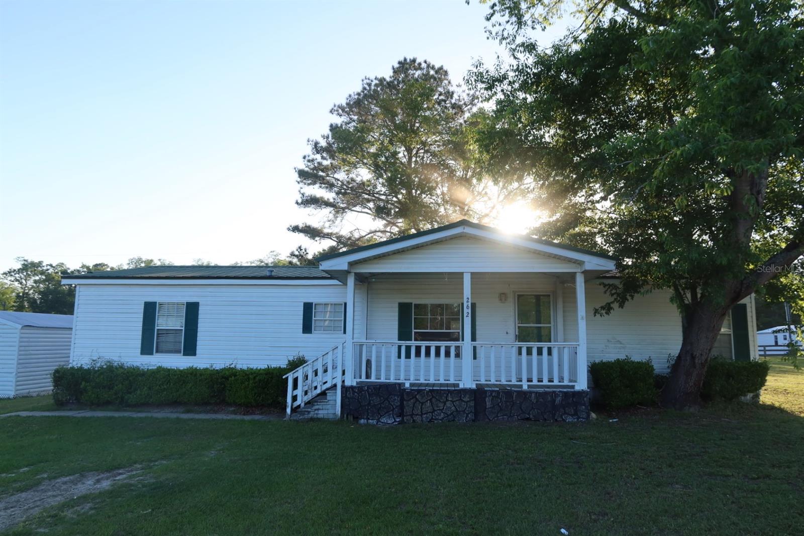 Discover the perfect blend of space, privacy, and convenience with this rare larger lot in beautiful North Florida! Nestled just minutes from town, this property offers the best of both worlds, peaceful country living with easy access to shopping, dining, schools, and everyday essentials.

Situated on an oversized lot, this well-maintained 1997 doublewide features 3 bedrooms and 2 full bathrooms with a comfortable, open layout designed for everyday living. The spacious yard provides plenty of room for outdoor activities, gardening, pets, or future additions, making it ideal for anyone looking to spread out and enjoy the Florida lifestyle.

Whether you're looking for a primary residence, rental investment, or a property with room to grow, opportunities like this don’t come along often. Larger lots this close to town are hard to find!

Come see the potential and make this North Florida property your own!
