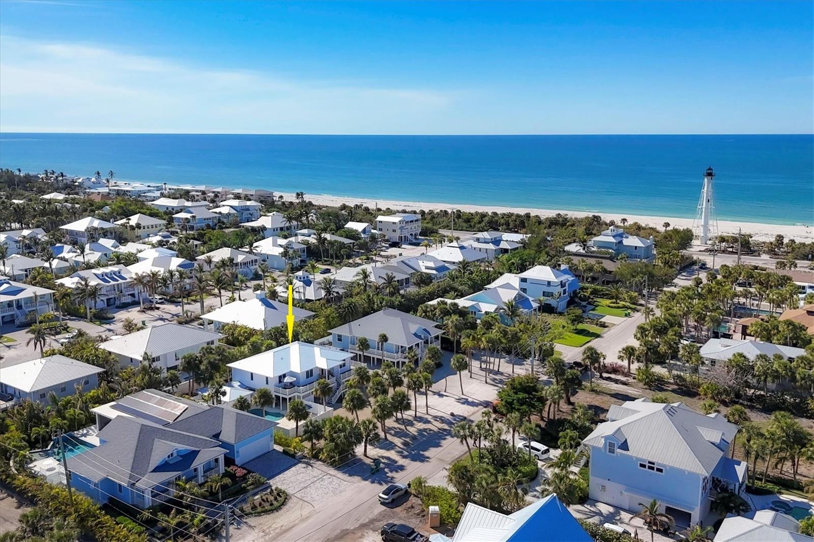 Perfectly located only steps to the beach and a quick bike ride to the village of Boca Grande!  This thoughtfully renovated 3 bedroom, 3 1/2 bath pool home is completely updated inside and out and offered turnkey furnished! The large and inviting front porch has plenty of room for outdoor living with seating to enjoy a meal or the colorful sunsets! Built with hardi plank siding, all impact resistant windows and doors, and a newer (2022) metal roof! Enter and you will find wood floors throughout, a living room detailed with built-ins, and a large dining area. The kitchen features an island with seating for 4, gas stove, quartz countertops, tile backsplash, stainless steel appliances and a wine refrigerator.  To enjoy the outdoors, there is a fenced and heated swimming pool area with an oversized pool deck offering open or covered seating areas. There is also plenty of open parking plus space under the house, as well as an enclosed golf cart garage! For the dog lover, this home is conveniently located near Lee County Park offering fenced dog parks. You can also enjoy the seasonal Boca Grande Famer’s Market, community tennis courts, and just a short walk to watch the spectacular sunsets on the Gulf waters beyond the Boca Grande range light built in 1927!