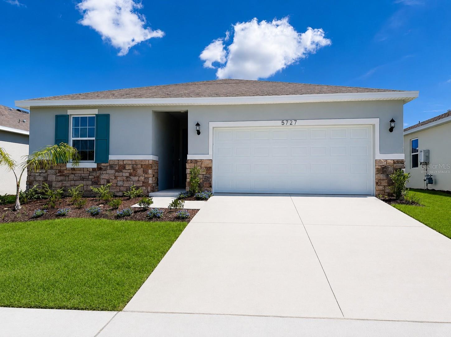 Virtually Staged. The Auburndale model offers comfortable single-story living with 9'4" ceilings and an open layout that connects the living, dining, and kitchen areas. The kitchen features upgraded countertops, cabinetry, and fixtures, along with a gas range and a microwave vented through the roof. The laundry room also includes a gas connection for the dryer.

This home includes a thoughtfully selected design package with luxury vinyl plank flooring throughout the main living areas and carpet in the bedrooms. Residents enjoy access to a spacious clubhouse with a fitness center, library, game room, and community gathering space, with a community pool coming soon.

A wonderful opportunity to enjoy low-maintenance living in a welcoming active adult community close to everything Central Florida has to offer. The Cottages of Sanders Grove, a gated 55+ active adult community surrounded by scenic landscapes and conservation areas, conveniently located near Leesburg, The Villages, shopping, dining, and the popular Yalaha Bakery.