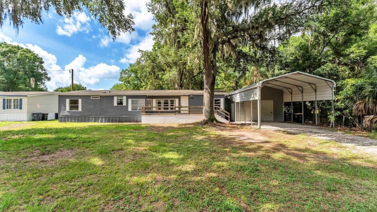 USDA financing may be available for qualified buyers, potentially allowing 100% financing with no down payment. Buyers should verify eligibility with their lender. Welcome to your slice of country living with room to breathe! Situated on approximately 0.65 acres, this well-maintained 3-bedroom, 2-bath home offers the perfect blend of privacy, functionality, and convenience. 
Step inside to find comfortable living spaces designed for everyday living and entertaining. Outside, the possibilities are endless. The oversized lot provides ample space for gardening, pets, recreational vehicles, boats, or simply enjoying the Florida lifestyle without the restrictions often found in subdivision communities.
One of the standout features is the large detached metal building/workshop, offering incredible flexibility for hobbyists, contractors, mechanics, small business owners, or anyone needing additional storage space. Whether you’re looking for a workshop, home business setup, equipment storage, or the ultimate man cave, this structure adds tremendous value and versatility.
Enjoy the peace and quiet of a larger homesite while remaining just a short drive from shopping, dining, schools, medical facilities, and major commuter routes. If you’ve been searching for a property with space, freedom, and a workshop that’s hard to find in today’s market, this is one you won’t want to miss.