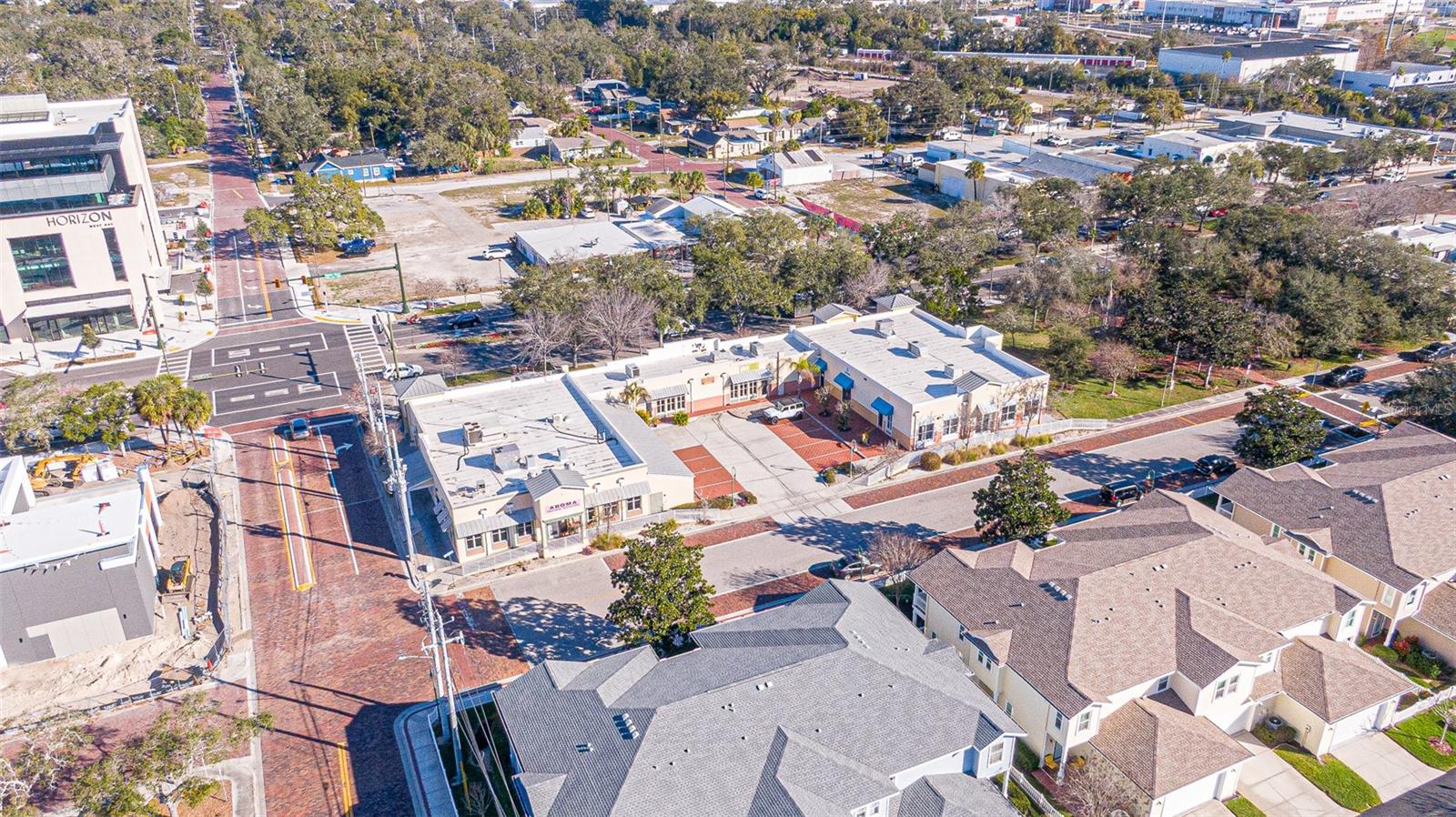 351 W Bay Dr offers investors a stabilized, income-producing retail asset with embedded upside and mixed-use redevelopment potential in the core of Downtown Largo. The property consists of five fully leased suites, delivering immediate in-place cash flow with a diversified tenant mix. Recent capital improvements materially reduce near-term capital expenditure exposure. In 2024, ownership completed a full silicone roof restoration across the entire building at an approximate cost of $34,000. Additionally, several suites have received new HVAC units within the past two years, strengthening the overall mechanical profile of the asset. Beyond stable current income, the property presents a compelling long-term value-add opportunity. The site has received approval from Pinellas Planning & Zoning for the potential addition of up to 16 residential units above the existing commercial structure (buyer to independently verify all zoning, land use, entitlement, and development requirements). This creates a rare opportunity for vertical mixed-use densification in a supply-constrained downtown corridor. Strategically positioned along West Bay Drive with strong frontage and visibility, the plaza is surrounded by significant public and private investment. Nearby developments include the Horizon West Bay project and the new 110,000± SF Largo City Hall complex featuring ground-floor retail and a 365-space public parking garage. The walkable downtown environment, anchored by Largo Central Park and Ulmer Park, supports consistent foot traffic and tenant demand. The asset benefits from proximity to major employment drivers, including HCA Largo Medical Center, and continued residential growth throughout the submarket. As Downtown Largo continues to mature, investors may capitalize on potential rent growth, tenant repositioning, and long-term redevelopment optionality. This offering presents an opportunity to acquire a stabilized retail property with near-term capital improvements completed and strategic upside in one of Pinellas County’s evolving urban nodes.