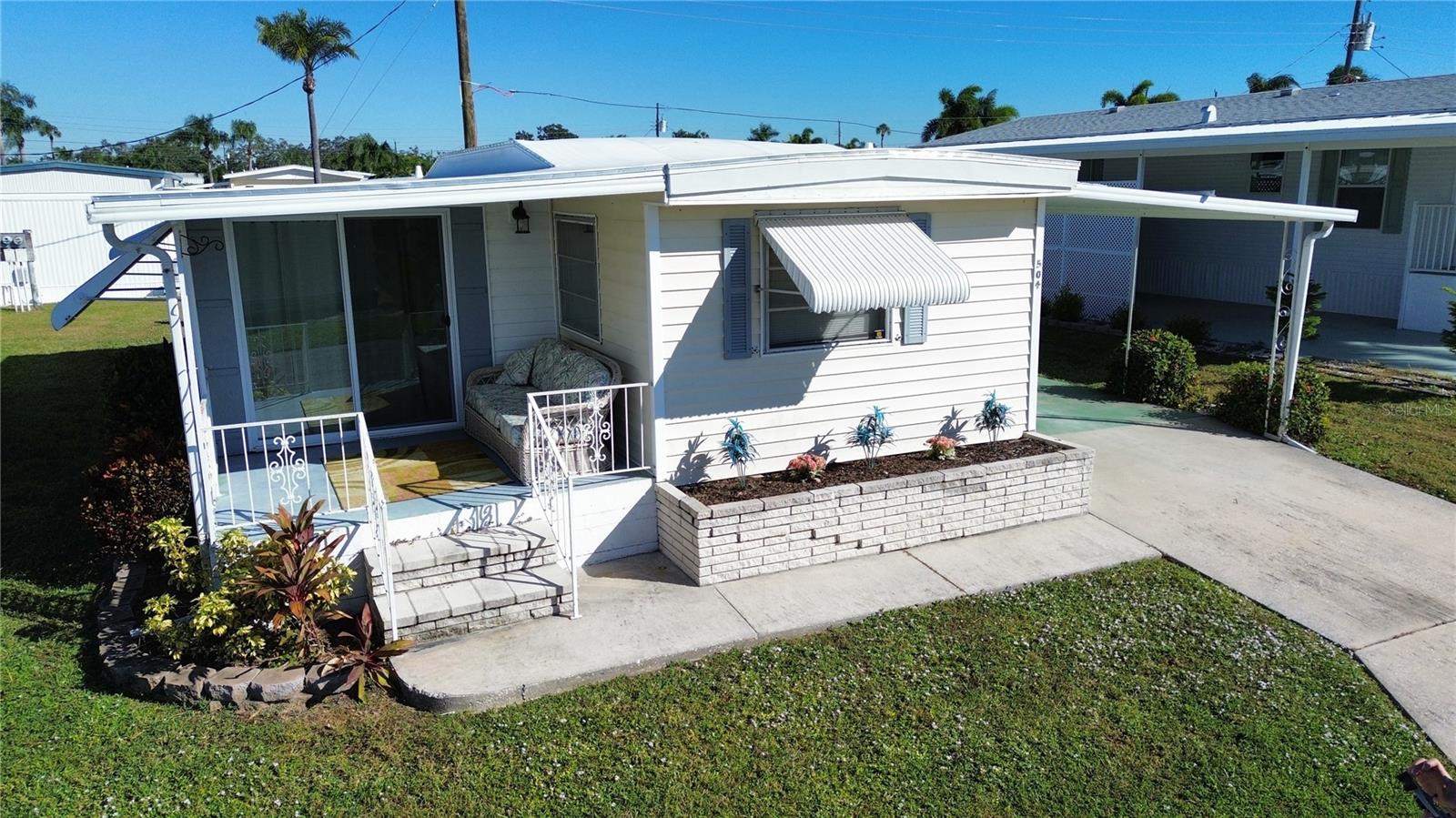 Now at a new, improved price. Your Florida lifestyle just became even more affordable.
This beautifully updated 2 bedroom, 2 bathroom turnkey furnished mobile home in the highly sought after Golf Lakes Cooperative Community is now priced to sell. With major upgrades already completed, this home offers exceptional value in one of the area’s most desirable 55 plus communities.
Recent improvements include a new roof in 2024 with transferable warranty, new kitchen cabinets with soft close doors and drawers and a lazy Susan, new hot water heater in 2023, and a new guest bath vanity with updated countertops in both the kitchen and guest bath. Every detail has been thoughtfully refreshed so you can move right in and start enjoying the Florida lifestyle.
The home features a charming, sunny front porch with a peaceful pond view, a screened lanai with vinyl weather panels, a covered carport, and a large storage shed with a full size washer and dryer. Located in a pet free, resident owned 55 plus community, Golf Lakes is gated and packed with resort style amenities including a par 3 golf course, heated pool and spa, fitness center, pickleball courts, shuffleboard, lawn bowling, and a vibrant clubhouse with year round activities.
Just minutes from Coquina Beach, Holmes Beach, Anna Maria Island, shopping, dining, and medical facilities, this home offers the perfect blend of convenience, value, and coastal living. Low monthly fees include water, sewer, trash, cable, internet, and more, making this an affordable option for full time or seasonal residents. Seasonal rentals are allowed, adding flexibility and potential income.
With a new price and move in ready condition, this is your chance to own a slice of the Gulf Coast at an unbeatable value. Schedule your showing today and start living the Florida dream.