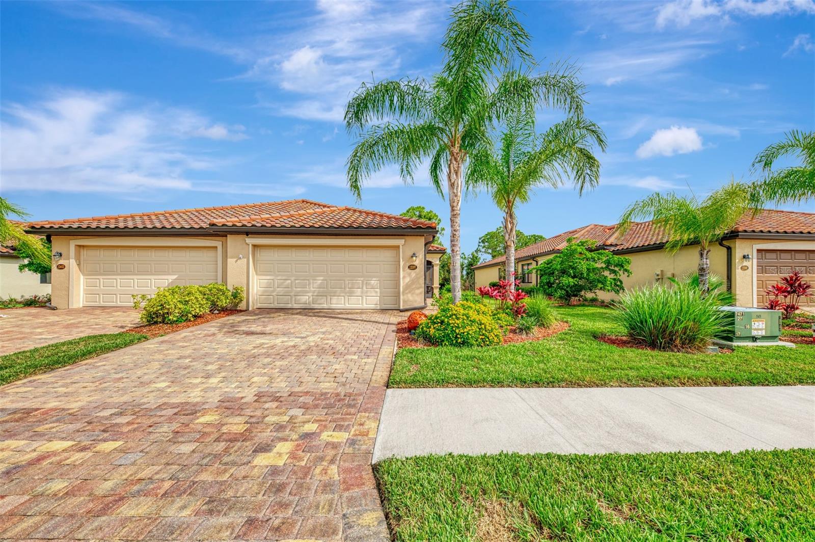 Experience resort-style living in the highly sought after gated community of Gran Paradiso! This beautifully maintained 2-bedroom, 2-bath villa with a versatile den offers an open and inviting floor plan, thoughtfully enhanced with updated lighting and modern ceiling fans throughout.

One of the home's standout features is the oversized 15' x 25' screened lanai, providing exceptional outdoor living space with a relaxing partial pond view perfect for entertaining, dining al fresco, or simply enjoying Florida's beautiful weather. For added peace of mind, the home is equipped with accordion hurricane shutters, an electric roll-down hurricane shutter on the lanai, and an FPL whole-home surge protector.

Gran Paradiso residents enjoy an exceptional array of resort style amenities, including an elegant clubhouse, state-of-the-art fitness center, resort style pool and spa, pickleball and tennis courts, walking and biking paths, and an active social calendar. Ideally located just minutes from Downtown Wellen Park, CoolToday Park, Gulf beaches, golf, shopping, and dining, this villa offers the perfect combination of comfort, convenience, and the Florida lifestyle you've been dreaming of.