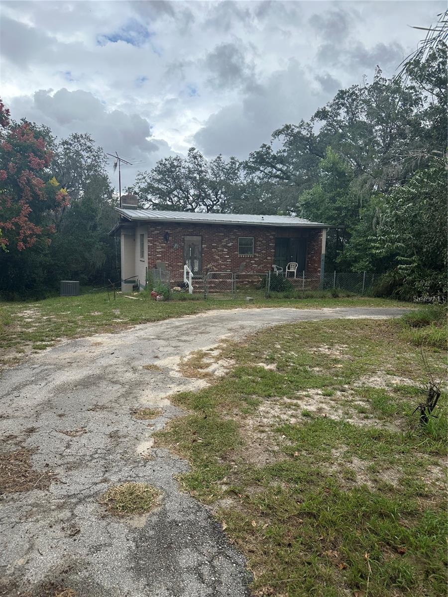 Escape to the serenity of country living on this stunning 36.93-acre property located in close proximity of Lake Alfred. Tucked away in a peaceful rural setting, this unique parcel offers a blend of open, undeveloped land and charming residential features that make it perfect for those seeking privacy, space, and endless possibilities.

At the center of the property, you’ll find a rustic country-style residence with a warm cabin feel, surrounded by mature landscaping that creates a natural, inviting atmosphere. A circular driveway provides easy access and a picturesque first impression. The home includes an unfinished basement, offering a blank canvas to expand your living space or create additional storage, a workshop, or even a private retreat.

Additional improvements include a barn and a shed, ideal for equipment, animals, or hobby projects. With plenty of open acreage, there is room for recreation or simply enjoy wide-open views and quiet country nights.