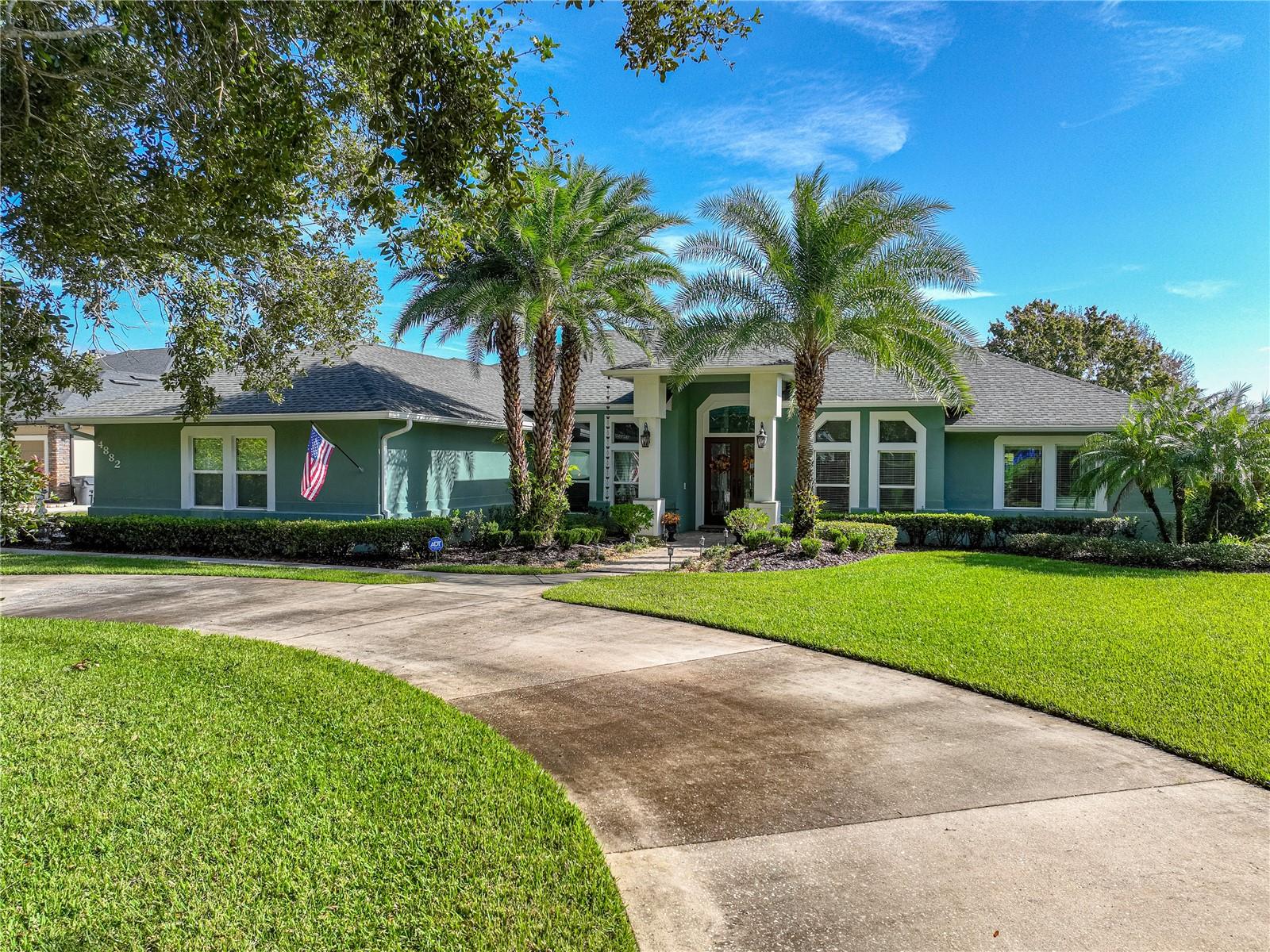 Exceptional true lakefront opportunity in the established, tree lined, waterfront, custom home neighborhood of Lake Juliana Reserve! 

This is a beautiful home that is made for gathering family and friends. Enjoy your morning coffee watching the sun rise over the sparkling waters of the lake, spend your day on the lake swimming, bass fishing, skiing or just taking the boat for a ride, come back to take a swim in the heated, salt system ,screened pool while dinner is cooking on the grill of the outdoor kitchen in the expansive back porch.  After dinner you can relax by the water in the separate screened room lakeside. If the weather is chilly enjoy the family room fireplace. 

Inside this spacious home has plenty of room for all your guests with a separate dining room, living room, family room and the lake room which all flow to each other and to the porch overlooking the pool and lake!  

With its high ceilings, extensive millwork and custom enhancements the quality is evident. The kitchen as dual ovens and dual microwaves along with an island, breakfast bar and breakfast nook to accommodate everyone. All countertops are granite including the outdoor kitchen . 

With 4 bedrooms and 3.5 baths there is room for all.  On one side of the home there are two bedrooms that share a Jack N Jill bath along with a 1/2 guest bath .  On the other side there is another bedroom, currently used as an office, along with a full bath that is also accessible from the lake room.   The master suite has a separate sitting room that is currently used as a dressing room with built ins and enjoys a lake view.  The master bath has two walk in closets  along with dual sinks, shower and jetted tub.  

There is plenty of parking available with a circular drive and side driveway that leads to an oversized three car garage with storage and work space, large garage doors and epoxy floors.  

The .74 acre lot has 108.50 ft of lake frontage including a covered boat dock with lift on Lake Juliana which is a 924 acre lake.  Well irrigation keeps the lawn and landscaping attractive without a city water bill. 

Auburndale is convenient to Tampa, Orlando, coastal beaches, central Florida attractions and has a charming downtown with a renowned park.  This home is only 6 minutes to I-4 and to a new Publix grocery store. Enjoy a lakefront lifestyle!
