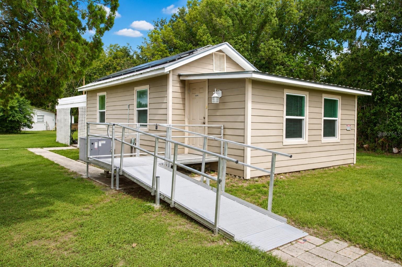 PAID OFF SOLAR + OVERSIZED LOT + METAL ROOF + WATER FILTRATION SYSTEM! Welcome to this beautifully updated 2-bedroom, 1-bathroom home located in the heart of downtown Zephyrhills, Florida. Combining modern updates with energy efficiency, this move-in ready home offers incredible value and low monthly utility costs thanks to the fully paid-off solar panel system—keeping electric bills remarkably low, even during Florida's hottest summer months. Inside, you'll find an updated kitchen featuring stone countertops, newer cabinetry, and plenty of workspace for cooking and entertaining. The home offers a blend of luxury vinyl plank flooring and carpet, providing both durability and comfort with easy maintenance throughout. Situated on an oversized lot, this property offers endless possibilities. Whether you're dreaming of expanding the home, adding a pool, creating the backyard oasis you've always wanted, or simply enjoying extra outdoor space, this property provides the flexibility to make it your own. A spacious 12x24 storage shed/workshop gives you plenty of room for tools, lawn equipment, hobbies, or recreational toys. Additional features include a durable metal roof, a major benefit for long-term maintenance and insurance savings, as well as the convenience of living just minutes from shopping, restaurants, medical facilities, parks, schools, and downtown Zephyrhills. With easy access to Wesley Chapel, Dade City, Lakeland, Tampa, and I-75, commuting is simple while still enjoying the charm of a small-town community. Whether you're a first-time homebuyer, downsizing, searching for an investment property, or looking for an energy-efficient Florida home, this property checks all the boxes. Don't miss this rare opportunity to own a move-in ready home with paid-off solar, a metal roof, oversized lot, and modern updates in one of Zephyrhills' most convenient locations. Schedule your private showing today before this one is gone!