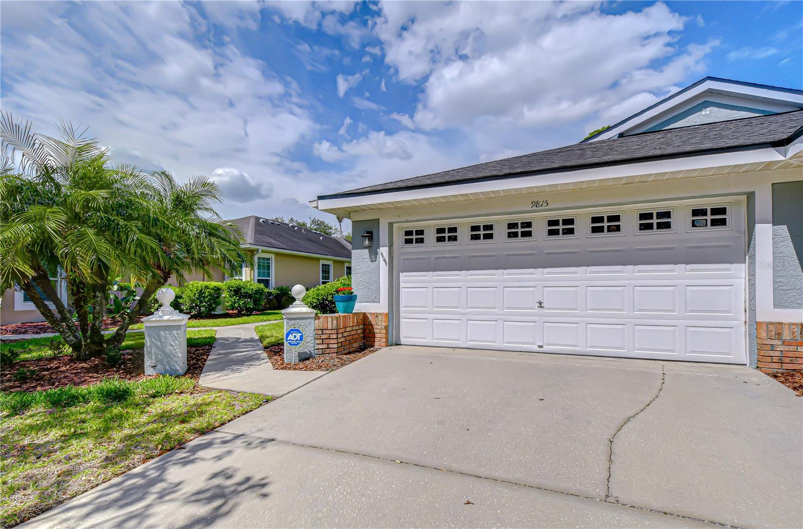 Come enjoy this MAINTENANCE FREE VILLA! Located in the GATED community of WOODBRIDGE in WESTCHASE with 1829 square feet of living space. Excellent location right across the street from all the West Park Village shops. This is the largest floorplan in Woodbridge; "The Doral", and features 3 bedrooms PLUS the extended master suite, 2 bathrooms, a 2-car garage and a HUGE, COVERED, SCREENED LANAI, providing plenty of room for comfortable living. With an exception Lot (larger than most in the community) with BEAUTIFUL CONSERVATION VIEWS.  As you step inside, the wide entryway leads you to where you will be immediately drawn to the open concept design that easily connects the kitchen, dining, and living areas. There are LOT OF INTERIOR UPGRADES to include UPGRADED 42 INCH KITCHEN CABINETS, GRANITE COUNTERTOPS, and STAINLESS-STEEL APPLIANCES. The LAMINATE FLOORING adds elegance and durability to the home. The spacious living room is perfect for enjoying get-togethers and has plenty of room for everyone. Don’t forget about the incredible HUGE Main Bedroom with extended main suite. There is so much room for all your furniture and then some. Both bathrooms have been UPGRADED to include GRANITE COUNTERTOPS. Main bath has DOUBLE SINKS and a BATHTUB to enjoy and relax into. This home also includes CROWN MOLDING and SHUTTERS THROUGHOUT. This villa is impeccable and truly move-in ready! There is a community pool in Woodbridge for the residents PLUS access to ALL Westchase amenities including 2 heated swimming pools, 2 tennis centers, golf course and parks/playgrounds. Maximum pet weight is 30 lbs.