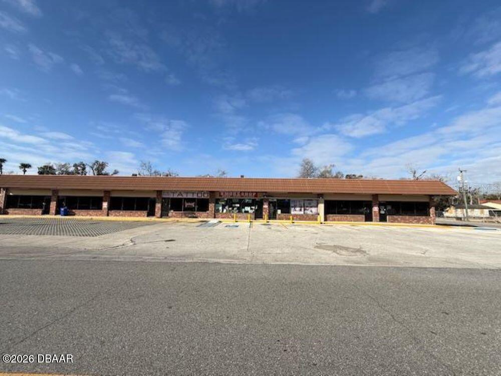 12,600 SF | Top-Tier Block Construction with Immediate Income and Occupancy Options This is an opportunity to own one of the best-built properties in the region. The 12,600 S.F. block construction building features durable concrete truss ceilings and has seen many recent, high-value upgrades. Currently, the property is 100% leased, providing a stable income stream. However, for a buyer looking to establish or expand operations, there is an owner-occupancy opportunity for up to 3,900 S.F. of space. The building was constructed to offer maximum versatility (originally 16 self-contained spaces) and can easily accommodate a wide range of needs, such as dedicated retail up front and functional warehouse space in the back, complete with a roll-up door. Recent Capital Improvements: New digital sign installed last year ($15,000). Roof sealing completed on the TPO roof. New soffit lighting and professional paint touch-ups.

Located in the Volusia County Unincorporated Area, the property is ideal for many commercial uses. Qualified buyers are encouraged to inquire about the possibility of partial owner financing.
