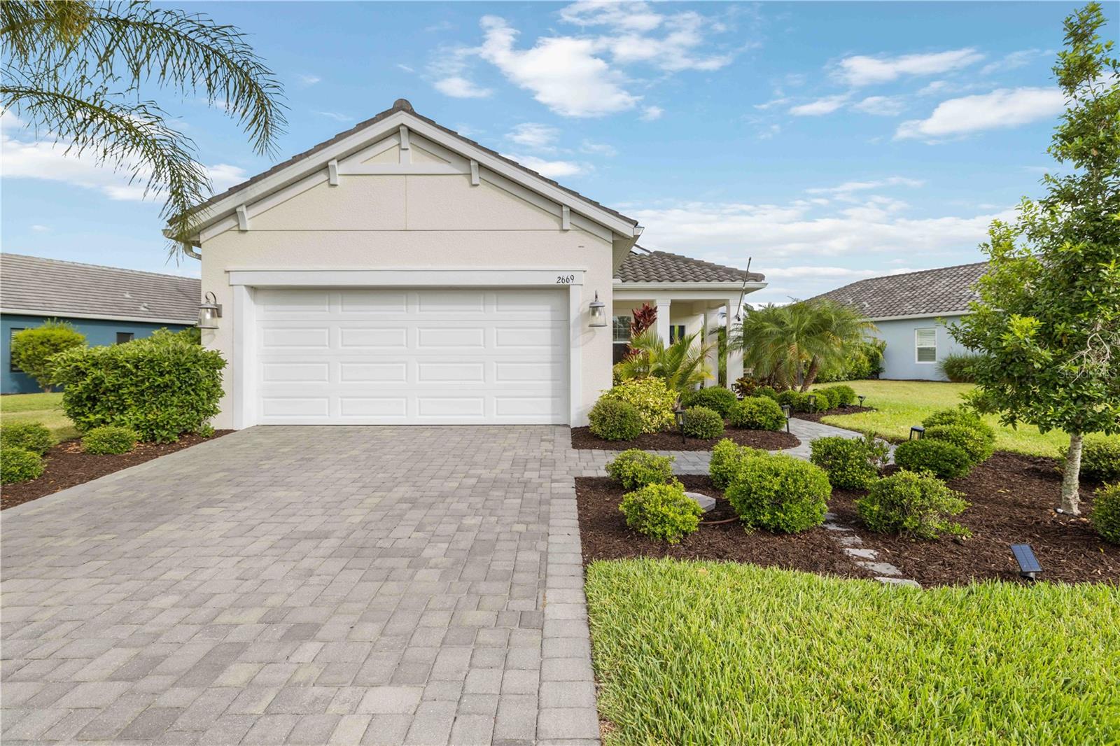 PRICE IMPROVEMENT! Discover exceptional value in this beautifully upgraded 3-bedroom, 2-bath residence located in the highly desirable Windward at Lakewood Ranch community. Built in 2021 and meticulously maintained, this move-in-ready home combines modern design, premium upgrades, and effortless Florida living. An ASSUMABLE 3.62% MORTGAGE presents a rare opportunity for qualified buyers in today's market.

Step inside to an inviting open-concept layout highlighted by elegant crown molding throughout the main living areas, dining space, kitchen, and stunning coffered ceiling detail. Thoughtfully designed for modern living, raised outlets have been installed in the living room, bedrooms, and lanai, creating a clean and seamless setup for wall-mounted televisions.

The chef-inspired kitchen features quartz countertops, stainless steel appliances, under-cabinet lighting, generous cabinetry, and ample workspace for entertaining or everyday enjoyment. The spacious primary suite serves as a private retreat, complete with two oversized walk-in closets and a well-appointed en-suite bath featuring dual vanities and a walk-in shower.

Outdoor living is equally impressive. Relax on the extended screened lanai overlooking a fully fenced backyard enhanced by privacy landscaping and a custom travertine patio—perfect for a fire pit, outdoor gatherings, or simply enjoying Florida's beautiful weather.

Additional features include an extended garage with utility sink, pull-down attic access with additional floored storage, ceiling-mounted garage storage racks, and recently cleaned, sanded, and sealed paver driveway and walkways. Every window is outfitted with white wood blinds, while the rear sliding doors feature added vertical blinds for privacy and convenience.

Most furnishings are negotiable, offering a turnkey opportunity for buyers seeking flexibility. Garage cabinetry and workbench may also be included.

Residents enjoy access to Windward's resort-style amenities, including gated entrances, community pools, fitness center, clubhouse, tennis courts, pickleball, and more. Conveniently located just minutes from Lakewood Ranch Main Street, Waterside, UTC shopping and dining, I-75, and the Gulf Coast's renowned beaches.

Offering an outstanding combination of location, upgrades, lifestyle, and value, this home is ready for its next owner. Schedule your private showing today.