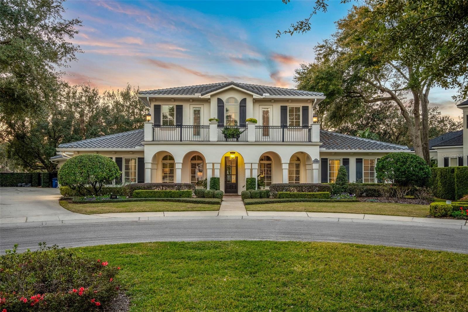 Nestled in the exclusive, sought-after cul-de-sac of Via Tuscany Oaks, this estate offers a rare opportunity to own a premier piece of Winter Park real estate. Situated among only six other distinguished homes and surrounded by a meticulously landscaped central park, this property perfectly blends privacy, elegance, and an unmatched location.

The chef’s kitchen is a masterpiece of both design and functionality, featuring custom copper sinks, exquisite marble countertops, and custom cabinetry—an ideal space for both intimate meals and large gatherings. Step outside to find an entertainer’s dream: a custom-built summer kitchen complete with a grill, wet bar, refrigerator, and kegerator. This outdoor space is designed for luxury living, with a pool bath, putting green, and outdoor shower, creating the perfect atmosphere for both relaxation and entertainment.

The first-floor Master Suite is a true sanctuary, offering a serene retreat with a spacious spa-like bath that includes a steam shower, vaulted ceilings, and dual walk-in closets—providing both comfort and luxury.

Upstairs, four additional bedrooms, two full baths, and a balcony overlooking the central park offer an abundance of space and tranquility, with a perfect balance of privacy and scenic views.

Located just steps from the Winter Park Racquet Club and only a short stroll to the renowned Park Avenue, this home places you in the heart of everything Winter Park has to offer—award-winning dining, shopping, and cultural experiences.