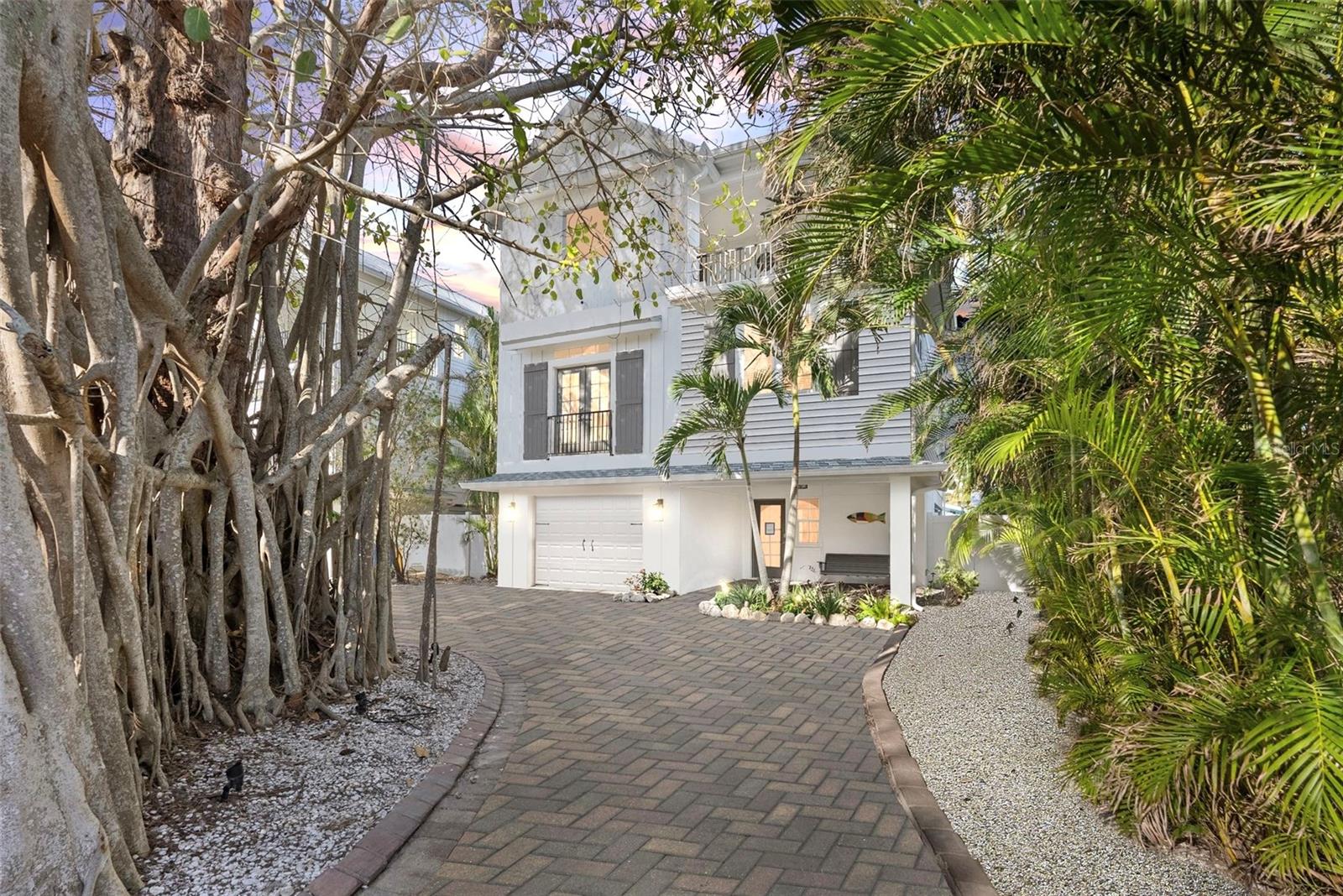 TURNKEY TROPICAL TREASURE: ANNA MARIA ISLAND’S ULTIMATE BEACH LIFESTYLE

Imagine stepping into your own slice of tropical heaven, where pristine Gulf waters meet unparalleled luxury and smart investing. This extraordinary Key West-style home is not just a property—it's your ticket to a life most only dream about. Newer construction (2015) and offering 2,601 sq ft, this architectural gem offers a perfect blend of personal retreat and powerful income generator.

The outdoor living experience is nothing short of spectacular, featuring a resort-style pool that transforms your backyard into a private oasis. A stunning rock waterfall cascades into the pool, while an expansive paver patio deck provides the perfect entertaining space. The thoughtfully designed outdoor living room, complete with a mounted TV for catching the big game, offers a shaded retreat with a patio covering for perfect dining outdoors and one that ensures cool comfort during those sunny and shelter from passing rainshowers. This is more than just a backyard—it's an entertainment paradise that will maximize every moment.

Inside, the home continues to impress with its carefully designed living spaces. The massive master suite is a true sanctuary, featuring a luxurious en-suite bathroom and private retreat that promises ultimate relaxation. For families or groups, two additional guest rooms offer a unique shared Jack and Jill bathroom configuration, with each room boasting its own private balcony—giving guests both shared convenience and personal space. These private balconies provide stunning views and personal retreats for each occupant, making the home perfect for multi-generational families or groups of friends. Outdoor living is also offered on an expansive deck just off the main living area which offers another area for dining, and a grill.

With flexible short term rental regulations allowing daily/weekly/monhly stays, this 5-bedroom, 4-bathroom home isn't just a vacation spot—it's a strategic investment that can cover its own mortgage while providing you a luxurious escape. The interior features soaring vaulted ceilings, custom wood cabinetry, and a gourmet kitchen with high-end stainless steel appliances that will delight both owners and vacation renters alike.

Located just steps from sugar-white sandy beaches (the beach entrance is less than a 5 minute walk) of one of the best-rated beaches in the world, this property delivers both lifestyle and financial brilliance. The home boasts modern amenities like a private elevator, updated kitchen and baths plus this is being sold turnkey with all furnishings so you can begin enjoying immediately.  Don't just buy a house—secure a lifestyle and a smart financial asset here. Your dream of coastal living and intelligent investing awaits you.  Schedule your showing today and transform your future with one extraordinary property.