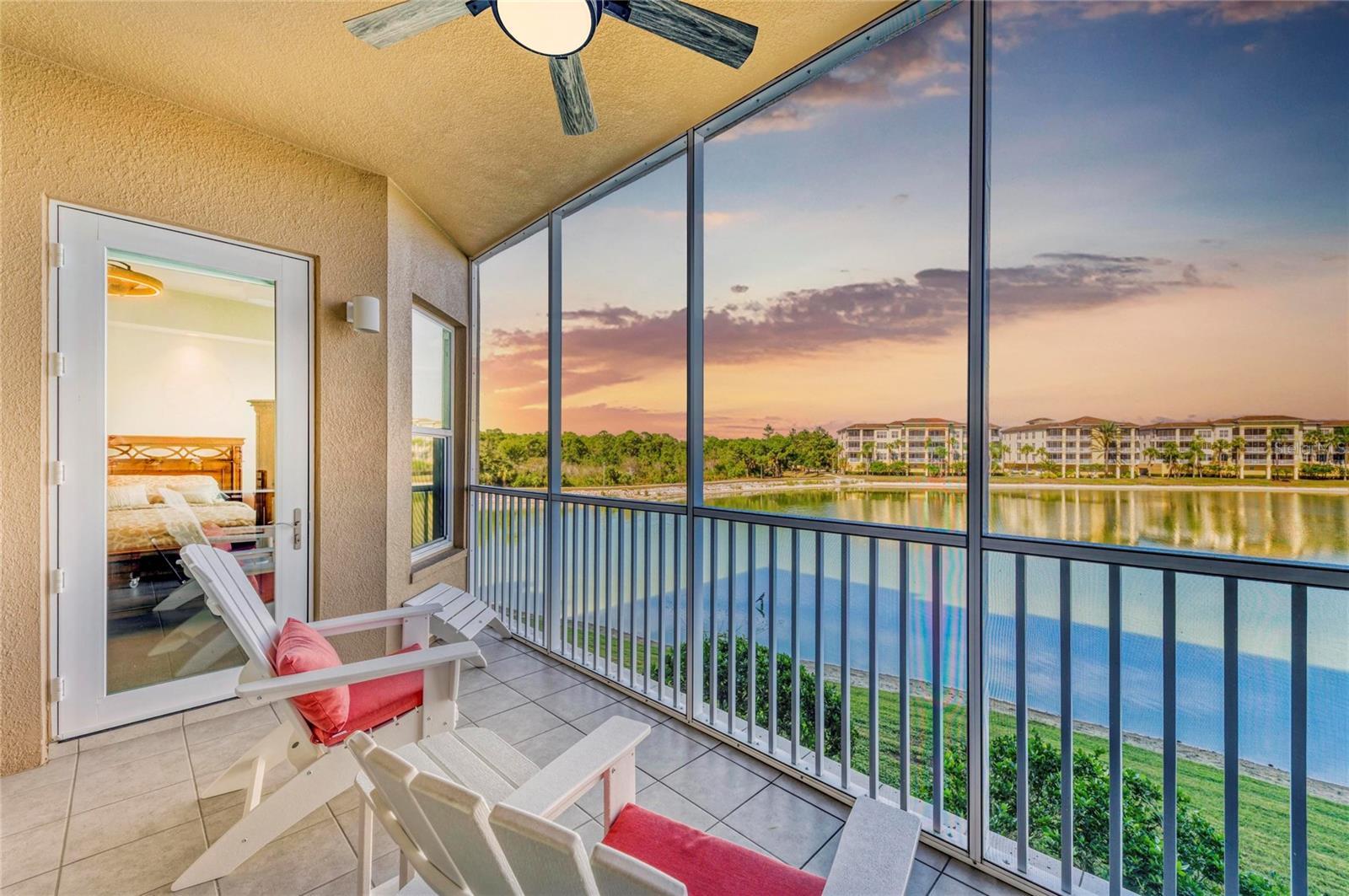 BEST PRICED-WALKABLE LUXURY CONDO AT WATERFRONT AT MAIN with SPECTACULAR VIEWS-Enjoy effortless lifestyle with maintenance-free living and some of the most captivating views in Lakewood Ranch at Waterfront at Main. Perfectly positioned in the center of the community of Lakewood Ranch, these condos place you steps from dining, boutiques, entertainment, health care, and recreation, along scenic Lake Uihlein.
This second-floor residence boasts exceptional lake views—its lower vantage point creates a wider, more intimate panorama view.  From your private screened balcony with tile flooring, take in a daily show of ibis, herons, and other local wildlife, along with sunrise reflections dancing across the water and bird activity at dusk.
This Barbados Model has thoughtfully designed space with 2 bedrooms and 2 bathrooms, plus office/den offering elegance, airy style that defines the interior, highlighted by plantation shutters, tray ceilings and designer lighting. The open layout connects the kitchen, dining area, and great room, making entertaining seamless. A custom coffered ceiling elevates the great room, which flows naturally to the balcony through sliding glass doors that frame the lake. 
 The chef’s kitchen includes designer quartz countertops, glass subway backsplash and a stainless steel appliance suite.
Wake up to unobstructed lake views in the primary suite, complete with balcony access, plush carpet and a walk-in closet. The primary bath is equally impressive, offering a large walk-in shower, dual-sink vanity, private water closet, and linen tower. The additional bedroom has a full bath outside the doorway that provides excellent flexibility for guests.  The Office/Den can function as a 3rd Bedroom with privacy doors.
Additional conveniences include a spacious laundry room with ample cabinetry, an under-building assigned parking space, and a secure temperature controlled storage unit. Impact-rated windows and sliders, gated access, and maintenance provide added comfort and security.
Residents of Waterfront at Main enjoy exceptional amenities: a lobby and elevator, heated saltwater pool and spa, firepit and grill stations, fitness center, kayak storage, clubhouse that can host events and an active social calendar. All of this is walking distance to the vibrant Lakewood Ranch Main Street—home to an abundance of restaurants, shopping, a movie theater, mini-golf, walking trails, and medical services. Located in the nation’s top multi-generational community, you’ll also have access to A-rated schools, abundant parks, nearby golf courses and world-class beaches just a short drive away.  Make your appointment today!