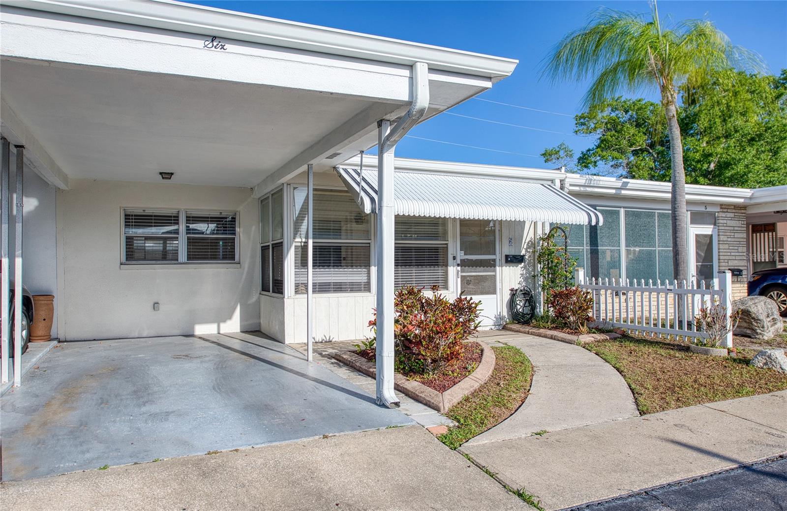 The Villa is a rare find offering one of the most affordable properties in Pinellas County living this close to the Gulf beaches (1.5 miles). This inviting 832 sq ft, 2-bedroom, 1-bath Villa (built 1970) sits in a well-maintained 55+ community and delivers exceptional value with low monthly HOA fees of just $170 (covers water, sewer & trash, grounds maintenance, clubhouse and pool maintenance).  Step into the covered screened front porch featuring a ceiling fan and convenient storage closet – the perfect spot for relaxing mornings or evening breezes. Inside, enjoy an open floor plan where the living room, dining area, and kitchen flow seamlessly together, creating a spacious feel ideal for everyday living and entertaining.  The two bedrooms offer comfortable retreats, while the full bath provides practical convenience. A standout feature is the direct access to the rear outdoor space – highly desired for privacy & gardening.  Community highlights include a refreshing pool, clubhouse, shuffleboard, and low-maintenance living. The location shines as truly walkable to every daily need: shopping, dining, banking, Publix, and more are just steps away. It's in a non-evacuation zone and non-flood zone, offering peace of mind during storm season.  Best of all, you're approximately 1.5 miles (a quick drive or enjoyable bike ride) from the sugar-sand shores of Indian Rocks Beach and the Gulf of America – unbeatable proximity at this price point.
Whether you're seeking a primary residence, winter retreat, or solid investment, this home checks every box for affordable, low-maintenance Florida living near the water.  Don't miss this opportunity in one of Largo's hidden gem communities!