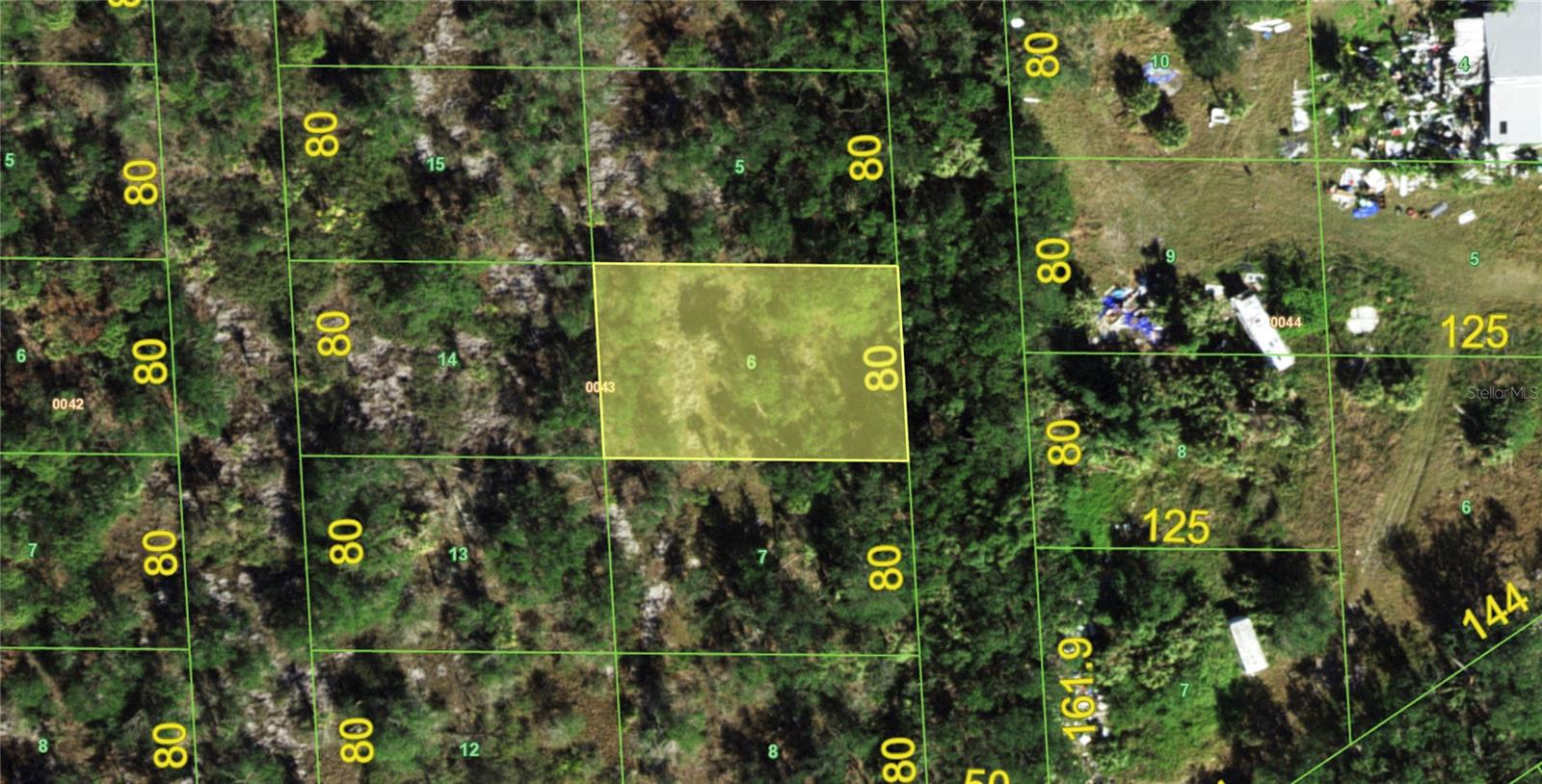 An exceptional land investment opportunity awaits in the peaceful Tee & Green Estates neighborhood of Punta Gorda. This prime 9,987-square-foot vacant lot measures 80 feet by 125 feet (0.23 acres), offering a blank canvas for buyers looking to secure a piece of Southwest Florida real estate at an incredible value. The property sits in a quiet, developing pocket of the community that is currently unimproved with no direct street accessibility at the moment, making it an ideal buy-and-hold piece or a strategic speculative addition to your real estate portfolio. When you are ready to build, a future home here will utilize a private well and a septic system. Best of all, buyers can move forward with complete confidence because this parcel IS NOT located in a designated scrub jay review area and contains NO WETLANDS, drastically streamlining your future planning process and eliminating costly environmental mitigation hurdles. 

Despite its quiet, off-the-beaten-path feel, this property boasts an unbeatable location that keeps you connected to all the major conveniences and world-class attractions of the region. Commuters and regional travelers will love being just a few minutes from Interstate 75, providing fast and seamless highway travel north and south throughout the entire state. Even better, the property is located just down the street from the Punta Gorda Airport (PGD), making travel a breeze for incoming guests or quick weekend getaways. You are also just a short drive from the historic charm of Downtown Punta Gorda, where you can spend your days exploring its vibrant waterfront, checking out local boutique shops, and dining at restaurants in Fishermans Village and throughout the rest of the City.

For those who thrive on the water or love the outdoor lifestyle, this location is an absolute dream. The lot sits in incredibly close proximity to both the Laishley Park Boat Ramp and the Darst Park Boat Ramp, offering incredibly easy access to launch your boat, kayak, or jet ski into the Peace River and Charlotte Harbor for world-class fishing and boating adventures. The area features multiple top-tier golf courses within a 20 minute drive, catering perfectly to the avid golfer looking for a sunny day on the fairways. Whether you are searching for a smart, long-term land investment or planning a future home in a rapidly growing coastal region, this exceptional Punta Gorda lot offers the perfect mix of price, potential, and lifestyle.