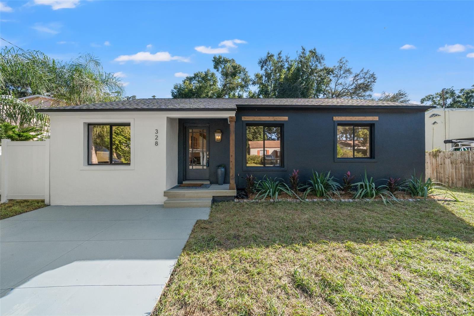 Tucked away in a quiet, cul de sac, leading to Henry & Ola Park and minutes from all the restaurants, bars and coffee shops in the sought after area of Seminole Heights, you will find the the home you've been looking for! This beautifully, remodeled 1940's house has been re-designed with an elegant, modern-mediterranean, appeal and functional layout to make your home-ownership dreams come true! With 3 bedrooms and two bathrooms in the main house along with an entire one bedroom one bath apartment, detached in the backyard, there are many possibilities on how to use this space for your personal needs. A perfect opportunity to have your mortgage paid for through rental income with it's own private entrance. The fenced-in backyard defines a relaxation oasis surrounded by beautiful landscape, including bamboo trees and light-up pergola and gas fire-pit, with the entire space covered in pavers! The inside of the home has been meticulously and entirely remodeled to the highest standards with brand new Cafe appliances, quartz countertops and custom range-hood, along with gorgeous herringbone flooring throughout and even a new roof! Book your showing to see this beauty for yourself!