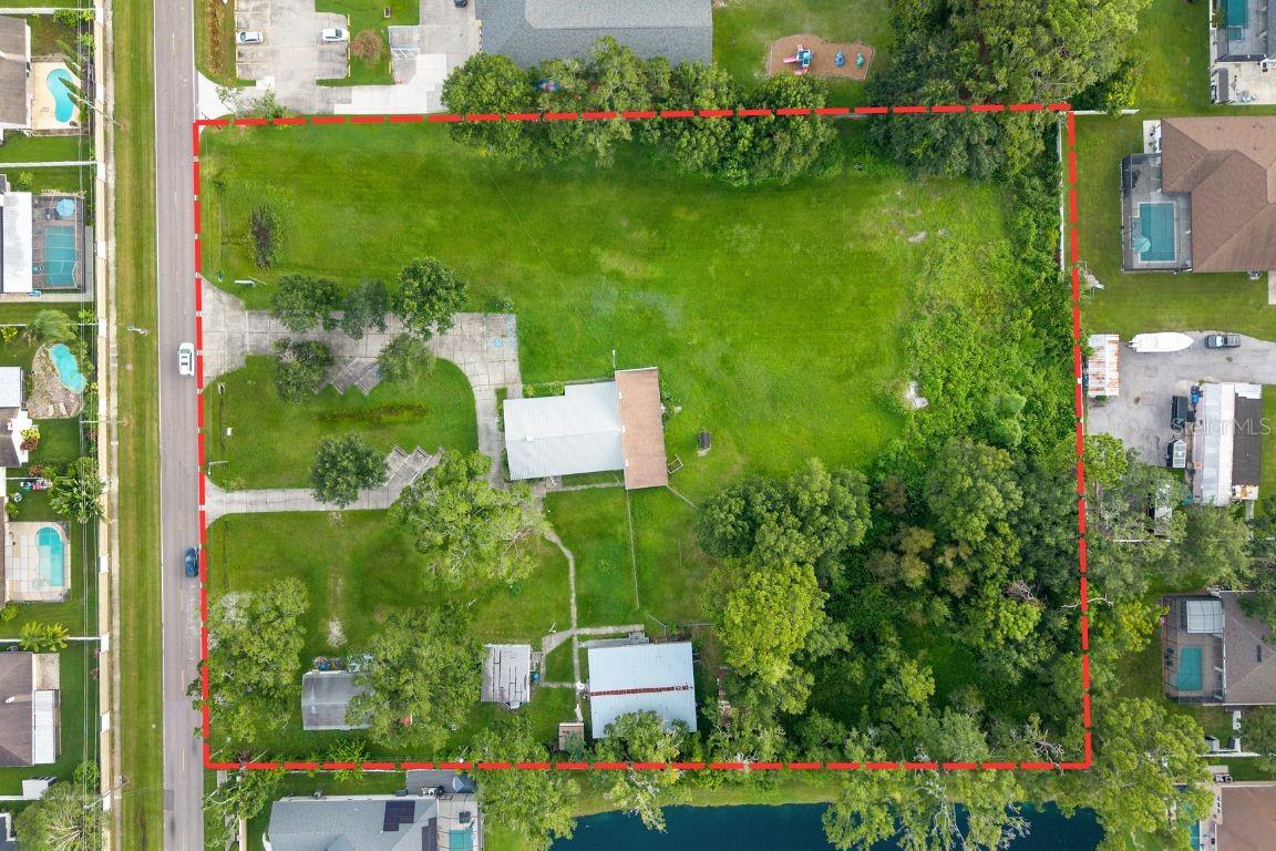 An extraordinary AS-IS opportunity to acquire 3.25 prime acres in one of Tampa’s most coveted and established submarkets — Carrollwood. Opportunities of this scale and versatility rarely come to market, making this a true developer’s dream and investor’s goldmine.

This exceptional property offers the potential for development of up to 12 single-family homes, paired with immediate value-add upside through the transformation of the existing church and three on-site storage buildings. Whether your strategy is ground-up development, strategic repositioning, fix & flip, or long-term hold, this asset delivers multiple high-performing exit paths.

Perfectly positioned just minutes from Downtown Tampa, Tampa International Airport, International Plaza & Bay Street, major highways, top-tier schools, premier dining, and retail, this location guarantees unmatched demand, premium pricing, and strong long-term appreciation.

With virtually no remaining large parcels in Carrollwood, this is a once-in-a-generation chance to secure a signature development site in one of Tampa Bay’s fastest-growing, highest-demand corridors.