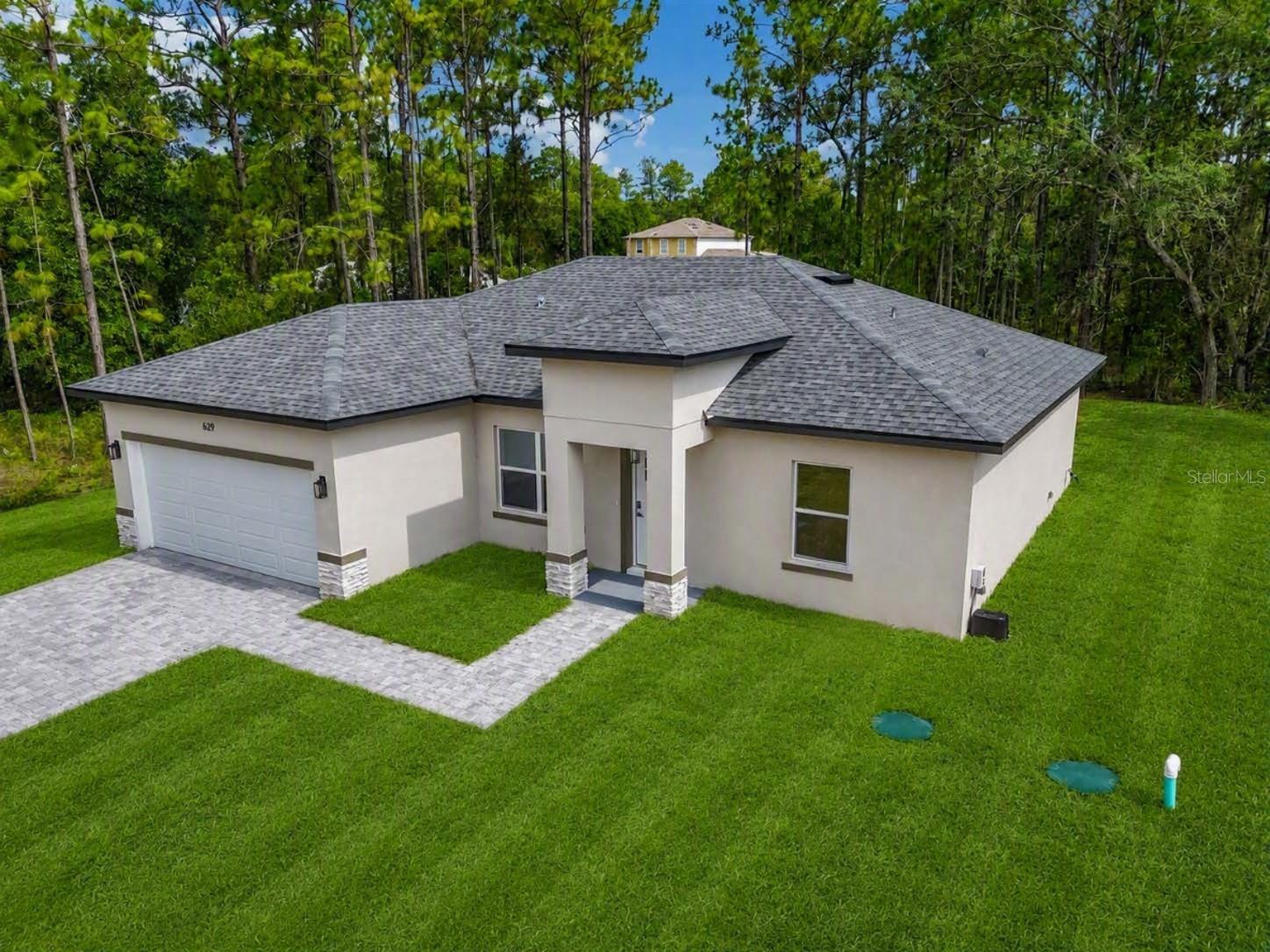 BRAND NEW CONSTRUCTION HOME!

Discover this stunning, move-in ready 3-bedroom, 2-bathroom modern home featuring a spacious 1,860 total sq ft layout in a rapidly growing, highly desirable community.

Enjoy ultimate peace of mind with an included, builder-provided 7-Year Customized State Warranty for Florida, featuring 1-year workmanship/materials coverage and 7-year designated structural protection. This comprehensive home warranty ensures your brand-new investment is protected from day one.

Boasting exceptional curb appeal, this contemporary property features an elegant paver driveway and high-end modern finishes throughout. Inside, you will find a bright, open floor plan fully equipped with brand-new stainless steel appliances.

Positioned in a peaceful neighborhood, this location offers easy access to premier shopping, dining, medical centers, and outdoor recreation. Excellent proximity to major highways ensures a seamless commute to nearby metropolitan hubs, making this property an ideal choice for full-time Florida living, a seasonal getaway, or a turn-key investment opportunity. Continued new development in the immediate area further enhances community value.

Easy to show—schedule your tour today through ShowingTime!