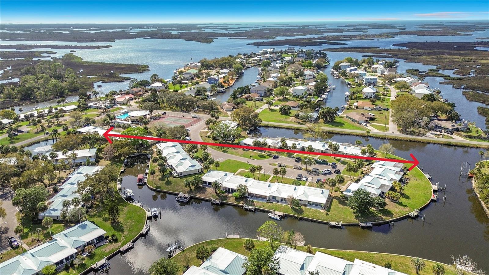 This Is THE Real Florida! Direct Gulf access and your own private boat pilings to build the most amazing boat dock to fit your watercraft. Beautifully remodeled throughout has this place fresher than your catch of the day. Looking to make a little extra cash? This unit allows 3 month rentals, so we welcome all investors too! The exclusive Islands of Dixie Shore condos, is nestled up to the 30,000-acre Crystal River Preserve where dolphins and manatees splash in your backyard. No fixed bridges here, just smooth sailing straight to the Gulf in the refreshing, salty breeze, making you feel like you are on vacation everyday! This beautifully updated 1-bedroom, 1-bath, poolside home offers the perfect blend of modern upgrades, functional comfort, and laid back lifestyle appeal, all within a well established tropical setting. From the scenic drive to the moment you arrive, the presence is all natural Florida beauty. Before entering, you will notice this cutie is highlighted by a new durable metal roof (2022) and beautiful natural landscape. Step inside to discover a bright, open interior enhanced by continuous luxury plank flooring that flows seamlessly throughout the home, creating both visual cohesion and everyday durability. For buyers who appreciate vintage charm, check out the furnishings, it could be yours - turnkey! Everything's negotiable! The renovated kitchen, features stone countertops, updated cabinetry, new appliances, and prep space that opens naturally into the main living and dining areas. Whether hosting friends or enjoying a quiet evening in, the layout supports both entertaining and peaceful living. The full bathroom has been tastefully remodeled with matching stone surfaces and modern finishes, delivering a clean, move-in-ready feel. Fresh interior paint, enhances the natural light and adds to the home’s polished presentation. Peace of mind comes from a series of significant system upgrades, including new plumbing and electrical components. Thanks to the comprehensive insurance coverage (FLOOD INSURANCE IS FULLY COVERED WITH YOUR CONDO FEE FOR THIS UNIT)! One of the home’s standout lifestyle features is the sunroom, offering flexible space for a second living area, dining nook, playroom, or home office. It opens to a rear patio overlooking the tranquil pond and fountain, ideal for outdoor lounging, grilling, or simply enjoying Florida’s year round sunshine. Plus, the community comes with a clubhouse, tennis courts (pickleball court coming soon), and a heated pool (year round swim vibes). The association fee covers cable, internet, full flood insurance, maintenance... basically, you just bring the sunscreen, fishing poles, boat and good vibes. This is your must see, must buy now, Florida dream. The best deal in the community! Don't let this treasure pass you by!
