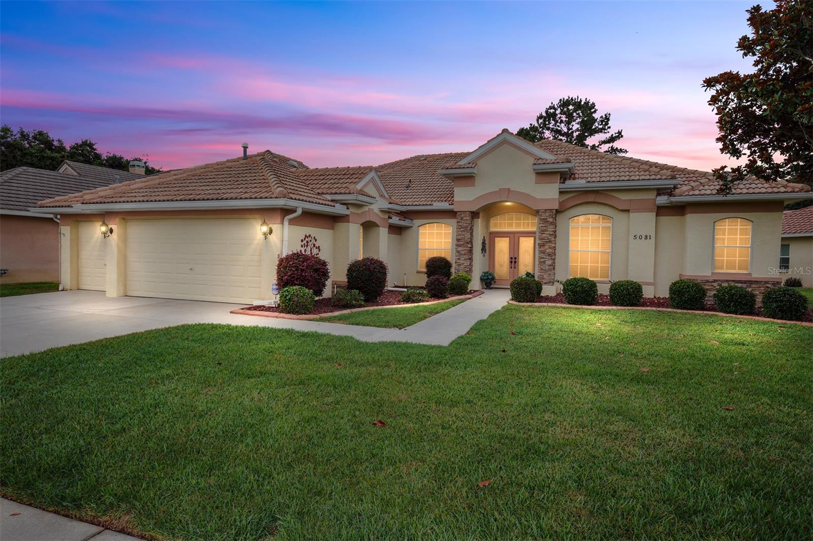Welcome to luxury golf course living in the highly sought-after gated community of Hernando Oaks Golf & Country Club. Perfectly positioned along the desirable 9th hole, this beautifully maintained 4-bedroom, 4.5-bath pool home with a 3-car garage offers over 3,000 square feet of spacious, elegant living designed for both comfort and entertaining.

From the moment you enter through the grand double doors, you’ll immediately appreciate the home’s open-concept layout, soaring 10–12 foot ceilings, abundant natural light, and impressive architectural details throughout. The spacious floor plan flows effortlessly from the formal living and dining areas into the expansive kitchen and family room, creating the perfect setting for everyday living and hosting guests.

The kitchen features extensive cabinetry, solid surface countertops, a center island, breakfast bar seating, and an open view overlooking the main living areas and pool.

One of the home’s standout features is the incredible screened-in pool and spa area overlooking the golf course, offering peaceful views and exceptional privacy. Whether enjoying your morning coffee, entertaining friends, or relaxing after a round of golf, this outdoor space captures the best of Florida living.

The versatile upstairs suite with private bath offers endless possibilities including guest quarters, bonus room, media room, home office, or potential 5th bedroom setup.

Additional highlights include:

Tile roof
3-car garage
Split-bedroom layout
Spacious owner’s suite
Multiple living and entertaining spaces
Mature landscaping
Gated golf community

Located just minutes from the Suncoast Parkway with convenient access to Tampa, shopping, dining, medical facilities, and Florida’s Gulf Coast amenities.

This exceptional golf course pool home offers the perfect combination of elegance, space, and lifestyle in one of Hernando County’s premier communities.