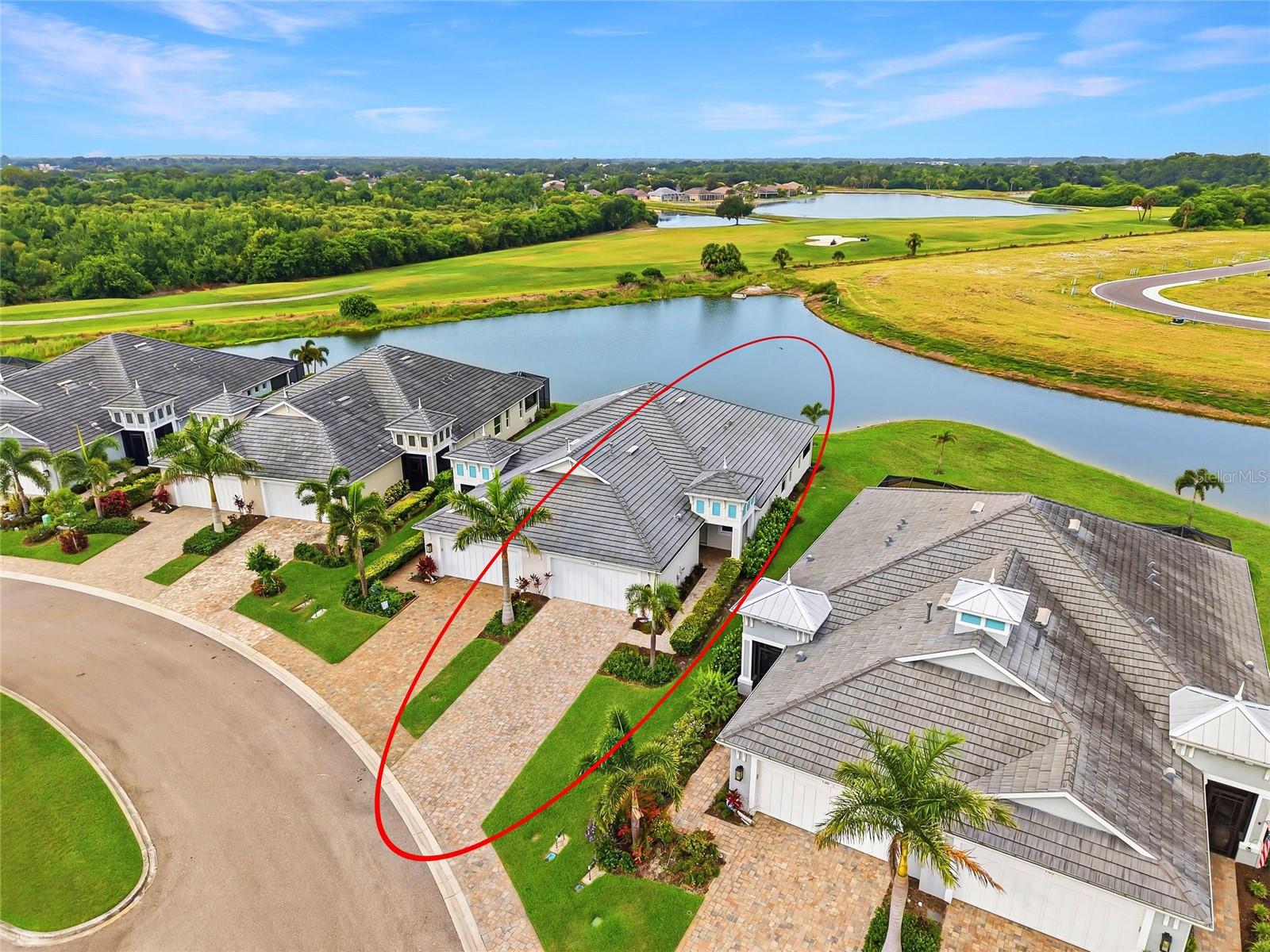 Nestled within the sought-after gated community of Watercolor Place, this beautifully appointed Boca Grande villa offers a rare combination of low-maintenance living, NO CDD FEES, and one of the most desirable homesites in the neighborhood. Featuring 2 bedrooms, 2 bathrooms, a den, and 1,625 square feet of thoughtfully designed living space, this popular floor plan maximizes every square foot while offering the comfort and convenience that make Watercolor Place such a sought-after address.  At the heart of the home is a beautifully appointed gourmet kitchen featuring quartz countertops, full overlay cabinetry, stainless steel appliances, a built-in wall oven and microwave, gas cooktop, hooded vent, and a large center island overlooking the dining area and spacious great room. The open-concept design creates a natural flow between the main living spaces, making the home feel larger than its footprint while providing an ideal setting for both everyday living and entertaining. Beautiful tile flooring extends throughout the entire home, creating a seamless look with no carpet to maintain. Conveniently located just off the main living area, the den offers flexibility for a home office, reading room, hobby space, or additional guest accommodations. The guest bedroom and full bathroom are thoughtfully positioned toward the front of the home, providing privacy for family and visitors, while the primary owner's suite is tucked away at the rear of the residence. Overlooking the pond, the owner's retreat features dual vanities, two walk-in closets, and a spacious walk-in shower with a seamless glass enclosure. What truly separates this property from other villa offerings is its premium homesite. Positioned along the widest section of the community pond, the screened lanai enjoys peaceful water views with Greenfield Plantation Golf Course creating a picturesque backdrop beyond. Combined with western rear exposure, the setting provides the perfect place to enjoy colorful Florida sunsets, morning coffee, or an evening glass of wine while taking in the scenery. Residents of Watercolor Place enjoy a maintenance-assisted lifestyle which includes lawn maintenance along with access to a community pool, clubhouse, and beautifully maintained grounds, all without the additional burden of CDD fees. Conveniently located just minutes from Lakewood Ranch and the thriving SR 64 corridor, homeowners enjoy easy access to shopping, dining, healthcare, and everyday conveniences including Costco, Whole Foods, Target, Publix, Lakewood Ranch Medical Center, and countless restaurants and entertainment options. For buyers considering new construction, this home presents an opportunity to enjoy one of the community's most desirable floor plans and homesites today, without the wait and at a less expensive price.