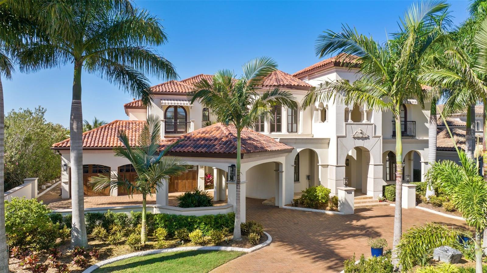 Designed to deliver exceptional waterfront living, enjoy spectacular water views and amazing sunsets from this stunning home. Privacy and elegance top the list of this spectacular Alvarez waterfront property located in the exclusive 24 hrs. gated community of Mirabay. This stunning pool home with a private dock and lift on a saltwater canal provides access to Tampa Bay, Apollo Beach, and South Shore waterside restaurants in just a few minutes. Discover the perfect blend of architectural genius, warmth, and sophistication. Offering Mizner-inspired architecture and attention to detail from the porte-cochere entry, European motor court and classic courtyard, to the graceful winding staircase and colonnade gallery with groin-vaulted ceilings. Refined elegance and outstanding craftsmanship greet you with Brazilian hardwood floors, 24-foot ceilings, sweeping water views and stunning outdoor living areas. Offering water views throughout the light-filled living spaces, with endless windows and gracious entertaining areas, the thoughtful design was specifically crafted for glamorous gatherings and the best of waterfront lifestyles in this resort community. The first level features spacious areas to entertain with a grand two-story foyer entry, living room, adjacent drawing room with wet bar that opens to the courtyard, formal dining room and gathering room. The chef’s kitchen boasts top-of-the-line appliances (Wolf & Sub-Zero), Cohiba granite countertops, center island and breakfast bar, butler’s pantry, wine refrigeration and a cozy breakfast area. A second level owner’s retreat provides a pleasant feeling to the lavish bath, private waterfront terrace, fireplace, morning bar and walk-in closet. Three additional guest bedrooms/baths and a study with water views also occupy the second level. Retracting glass doors lead to outdoor living areas with fireplaces, numerous entertaining areas, outdoor kitchen, infinity pool and spa overlooking the water. Multiple terraces, dramatic arched doorways, venetian plaster walls, Old World craftsmanship and custom molding throughout, mud room, full entertaining wet bar and 3-car garage with custom made shelving and brand-new built-in storage in garage.
Recently added upgrades, pavers, lighting, ceiling fans, brand new AC units, brand new water tank, curbing landscaping, outdoor lights, refinished wood floors, sound system through the house and many more.
Enjoy all the amenities Mirabay has a heated resort style Olympic swimming pool, waterslide, lap lanes, clubhouse, playgrounds, fitness center, tennis/basketball/pickle-ball courts, year-round activities and more. Sign out a kayak/canoe or paddleboard (free for residents) from the clubhouse and take a spin around the 135-acre lagoon.
This gorgeous community is conveniently located less than 10 miles from I-75 and has different access to main roads to Downtown Tampa, Tampa airport, best sport venues, new hospitals, charter schools and lots of shopping. Experience the beautiful Gulf beaches in addition to the Little Harbor resort located minutes away by car or boat. 
Your new life in this gem is just a signature away, request your private showing today.