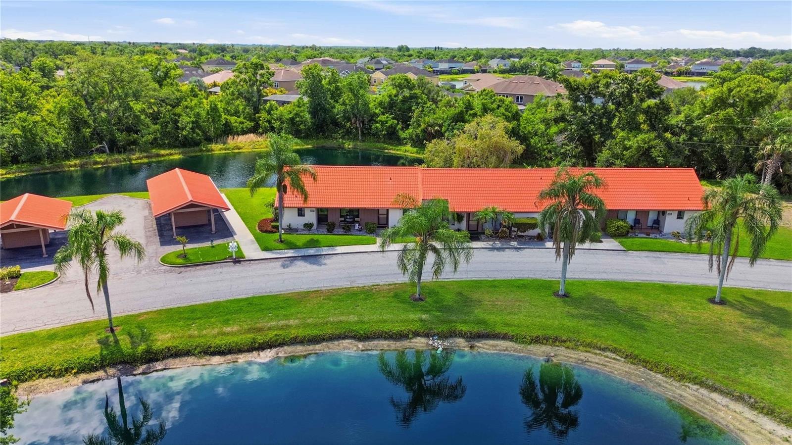 Tucked within one of Sarasota’s most peaceful hidden-gem communities, this rarely available Sunrise Condominium villa offers a setting that is truly hard to duplicate. One of only two villas in the community with tranquil pond views from both the front and rear porches, the home delivers a unique sense of privacy and serenity, creating the feeling of being surrounded by water and nature at every turn.

This spacious two-bedroom villa features the community’s desirable dual primary suite floor plan, each with its own en-suite bathroom. A standout feature unique to this home is the reimagined primary suite walk-in closet, thoughtfully converted into a private office space complete with its own window — a rare and highly functional addition not commonly found in Sunrise Condominium. Whether working remotely, pursuing hobbies, or simply needing additional flex space, this feature adds versatility and character to the home.

Recent improvements include impact windows and doors (2026) for peace of mind and energy efficiency, along with a newer HVAC system (2024) and additional attic insulation to enhance year-round comfort.  The cast iron sewer lines were also replaced in 2023 adding to the appeal of this unit. The vaulted ceiling in the great room creates an open and airy atmosphere, while still maintaining the warm and inviting feel that makes villa living so appealing.  Power operated window treatments on the sliding glass doors add to the convenience of this move-in ready home. 

Outdoor living is a true highlight here. Enjoy morning coffee from the front porch overlooking peaceful water views, then unwind in the evening on the rear covered and screened in patio with another calming pond backdrop. Few properties in the community offer this kind of immersive water view experience from both sides of the home.

Residents of Sunrise Condominium enjoy maintenance-free living with reasonable quarterly fees that include landscaping, irrigation, and exterior pest control among other items. Community amenities include a sparkling pool, tennis court/pickleball, and quiet winding streets ideal for walking and enjoying the Florida lifestyle.

Perfectly positioned just minutes from I-75, shopping, dining, and medical facilities, the home also offers easy access to world-famous Siesta Key Beach via nearby Clark Road, placing white sand beaches and Gulf sunsets within easy reach.  Restaurants, doctors offices, hospitals and shopping are all within a short drive!

Opportunities to own a villa with this combination of water views, flexibility, and location are exceptionally rare.