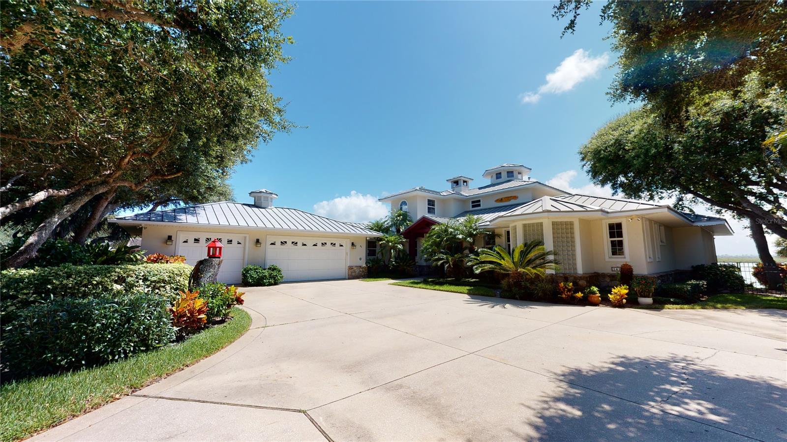 Stunning riverfront home features spectacular views of the Indian River from all rooms! Surrounded by tropical & lush landscaping, this 3BR/3BA/3GAR home features two oversized balconys & a 552 sq.ft. dock with boat lift to enjoy the boating lifestyle! Expansive double door entrance welcomes you to this home with an open floorplan great for entertaining! Gorgeous wood floors throughout the living & dining areas extend to the kitchen & hallway to the garage. 12' ceilings and walls of glass windows provide fantastic views of the yachts sailing by and beautiful sunsets everyday! Riverfront master suite opens to a large lanai and the master bath features a fabulous dressing room & walk in closet, along with double vanities & a walk in 2 headed shower stall with lots of tile & glass block.
Gourmet kitchen features gorgeous wood cabinets with pull out drawers & stainless appliances, topped with beautiful granite countertops. Cozy stone fireplaces in both the living room on the 1st floor & in the 3rd bedroom/office on the 2nd floor. Also, this home is located just 2 blocks to the beach & 1/2 mile to Flagler Avenue restaurants, shops & bistros. Truly one of a kind home which offers the best of Florida! ;Water: City
