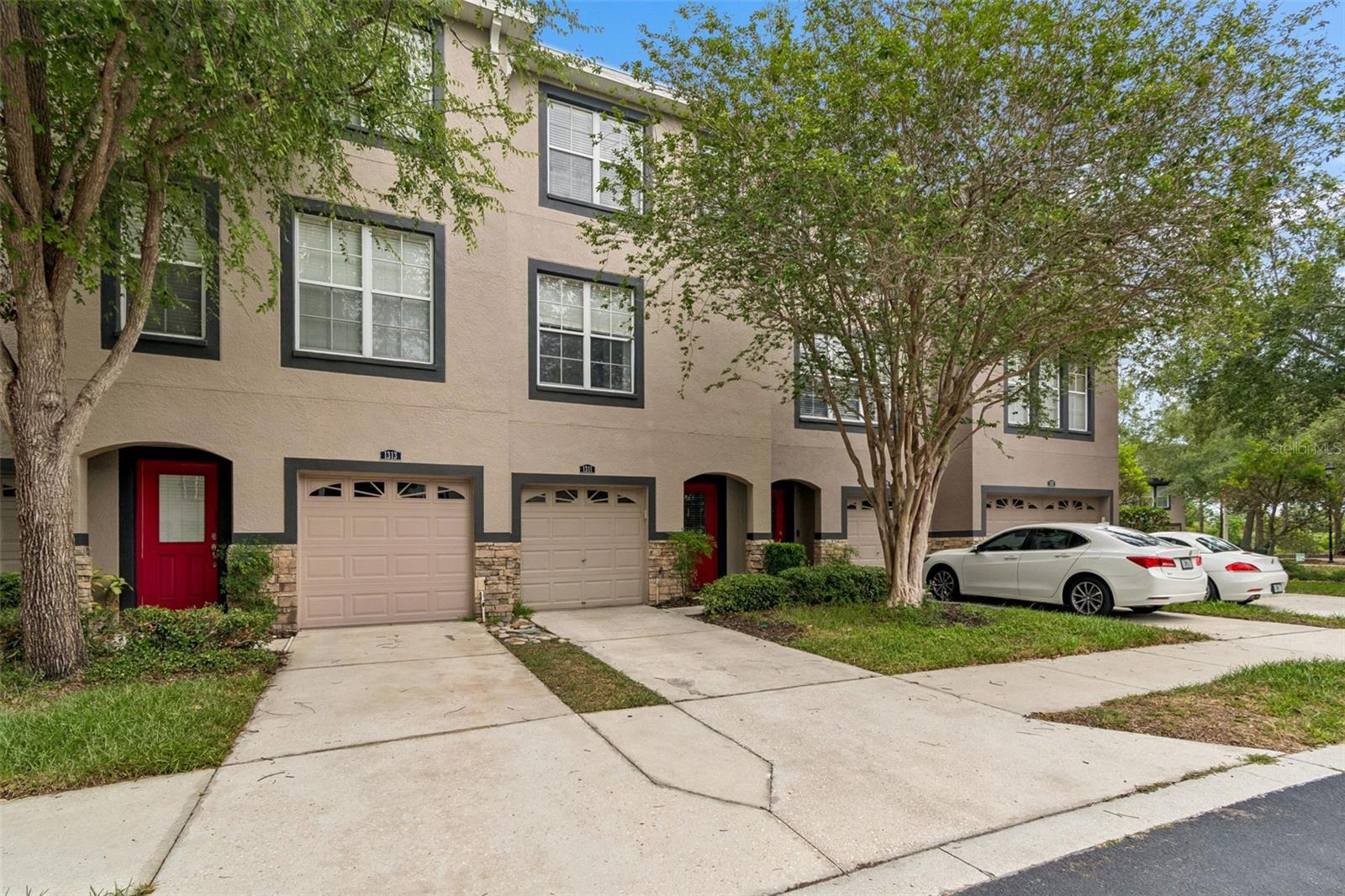 One or more photo(s) has been virtually staged. Welcome home to this spacious and beautifully maintained three-story townhome in the desirable Lake Brandon community! Offering four bedrooms and four full bathrooms, this thoughtfully designed home provides exceptional flexibility with private living spaces on every level.The first floor features a convenient primary suite complete with its own private bath and two generous closets, making it an ideal retreat for guests or a home office setup. The washer and dryer are also conveniently located on the ground floor.The main living level is bright and inviting, showcasing hardwood floors throughout the open-concept living and dining areas. The well-appointed kitchen features granite countertops, stainless steel appliances, ample cabinetry, and plenty of space for entertaining. This level also includes a secondary bedroom and a full bathroom, offering additional flexibility for family or guests.On the top floor, you’ll find two more spacious bedrooms, each with its own ensuite bath. The primary suite serves as a true owner’s retreat with a well appointed bathroom featuring a garden tub, separate walk-in shower, and a custom-built walk-in closet.Additional updates include brand-new carpet in the secondary living areas and fresh interior paint throughout, making this home truly move-in ready.Ideally situated in Lake Brandon, this community offers easy access to Causeway Boulevard, the Selmon Expressway, I-75, shopping, dining, entertainment, and everything the Tampa Bay area has to offer. This is low-maintenance living at its best in one of Brandon’s most convenient locations.