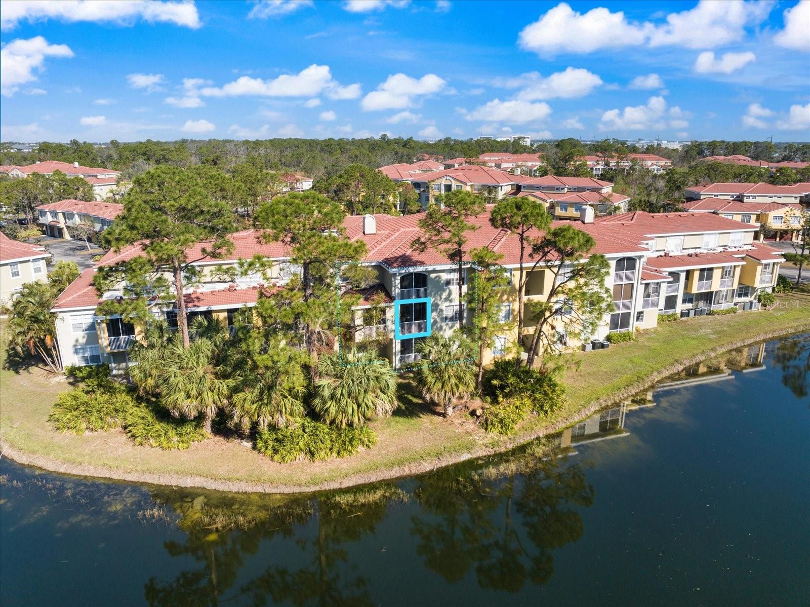 GORGEOUS AND PRICED TO SELL! Impressive upgrades, stylish, and great location! Step into the largest three-bedroom, two-bath floor plan in Las Palmas, where thoughtful design meets exceptional updates. This unique residence offers peaceful water views, lush mature landscaping, and a layout that truly stands out. From the moment you enter, you'll be captivated by the second story soaring ceilings, enhanced by an impressive catwalk feature that allows natural light to flood the space. The beautifully updated kitchen, modern laminate flooring, and meticulous upkeep make this home move-in ready. Newer AC system, a newer hot water heater, upgrades kitchen floors, and modern updates throughout.  Las Palmas is a highly sought-after gated community offering an unparalleled lifestyle. Enjoy direct access to Benderson Park through a private gate, making morning walks, bike rides, or trips to UTC effortless. No need to worry about parking for special events ... simply stroll or cycle to Sarasota's premier shopping and dining destination. Residents also have access to resort-style amenities, including two heated swimming pools, tennis courts, two clubhouses with a TV room, two fitness centers , a car wash station, a dog park, and even extra storage for RVs and large trucks. This home is a rare find and beautifully maintained, thoughtfully updated, and priced to sell. Don't miss your chance to own one of the best values in Sarasota. This condo is not only exciting to view but it's also priced below well below it's value, and incredibly well taken care of by it's current owners. Schedule your showing today!