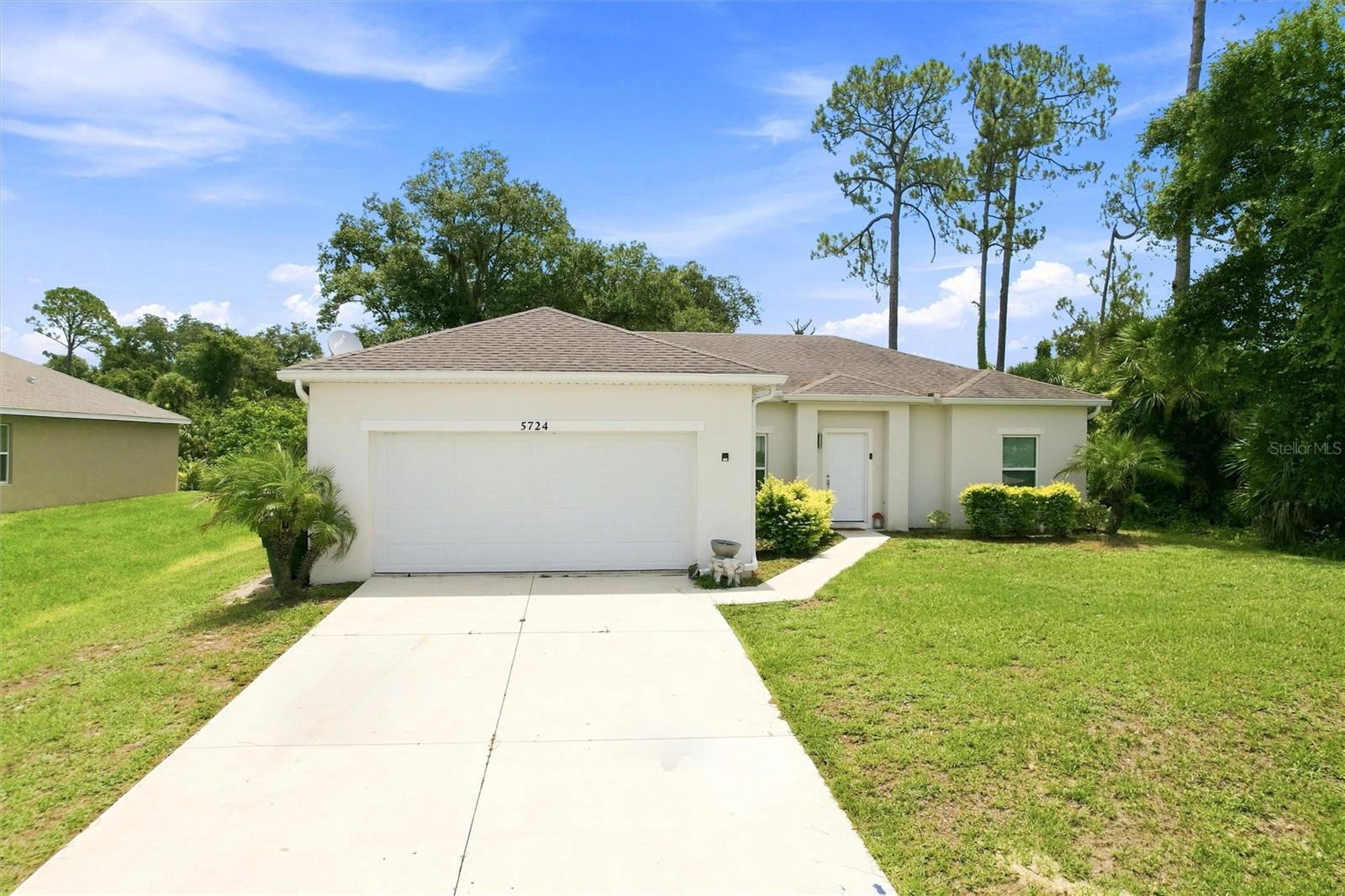 Welcome to this beautifully maintained 3-bedroom, 2-bathroom home with a 2-car garage, built in 2020 and offering 1,506 square feet of comfortable living space. Ideally situated on a spacious lot in desirable North Port and located outside of a flood zone, this move-in-ready residence features an open and inviting floor plan filled with abundant natural light. Designed for both everyday living and entertaining, the home seamlessly blends comfort, style, and functionality in a peaceful setting surrounded by Florida's natural beauty. At the heart of the home, the thoughtfully designed open-concept layout brings together the living room, dining area, and kitchen into one expansive gathering space. The living and dining areas feature comfortable carpeting that adds warmth and comfort, while the kitchen is finished with durable tile flooring for easy maintenance. The well-appointed kitchen offers stainless steel appliances, ample cabinetry, generous counter space, a convenient breakfast bar, and a spacious pantry for additional storage. Just off the kitchen, you'll find a dedicated laundry room that provides easy access to the attached 2-car garage, adding both convenience and functionality to everyday living. Recessed lighting, neutral finishes, and the open flow throughout the main living areas create a bright and welcoming atmosphere perfect for entertaining guests, spending time with family, or simply enjoying the Florida lifestyle. The thoughtfully designed split-bedroom floor plan provides privacy and comfort for everyone. Tucked away on one side of the home, the spacious primary suite serves as a private retreat, featuring plush carpeting, a large walk-in closet, and an en-suite bathroom with a granite-topped single-sink vanity and a walk-in shower. On the opposite side of the home, two comfortable guest bedrooms also feature plush carpeting and built-in closets, providing ample storage space. These bedrooms share a full guest bathroom, creating an ideal setup for family members or visitors. Step outside to the oversized backyard, offering endless possibilities for outdoor enjoyment. Whether you're planning family gatherings, creating a garden oasis, adding recreational space, or building the pool of your dreams, there's plenty of room to make it your own. Conveniently located near shopping, dining, parks, schools, and all the amenities Southwest Florida has to offer, this property presents an exceptional opportunity to enjoy the best of Florida living. A tenant is currently in place, making this an attractive investment opportunity with immediate rental income potential while also offering future possibilities as a primary residence, vacation home, or seasonal retreat.
**PLEASE ENJOY THE 3D INTERACTIVE VIRTUAL TOUR ASSOCIATED WITH THIS LISTING**