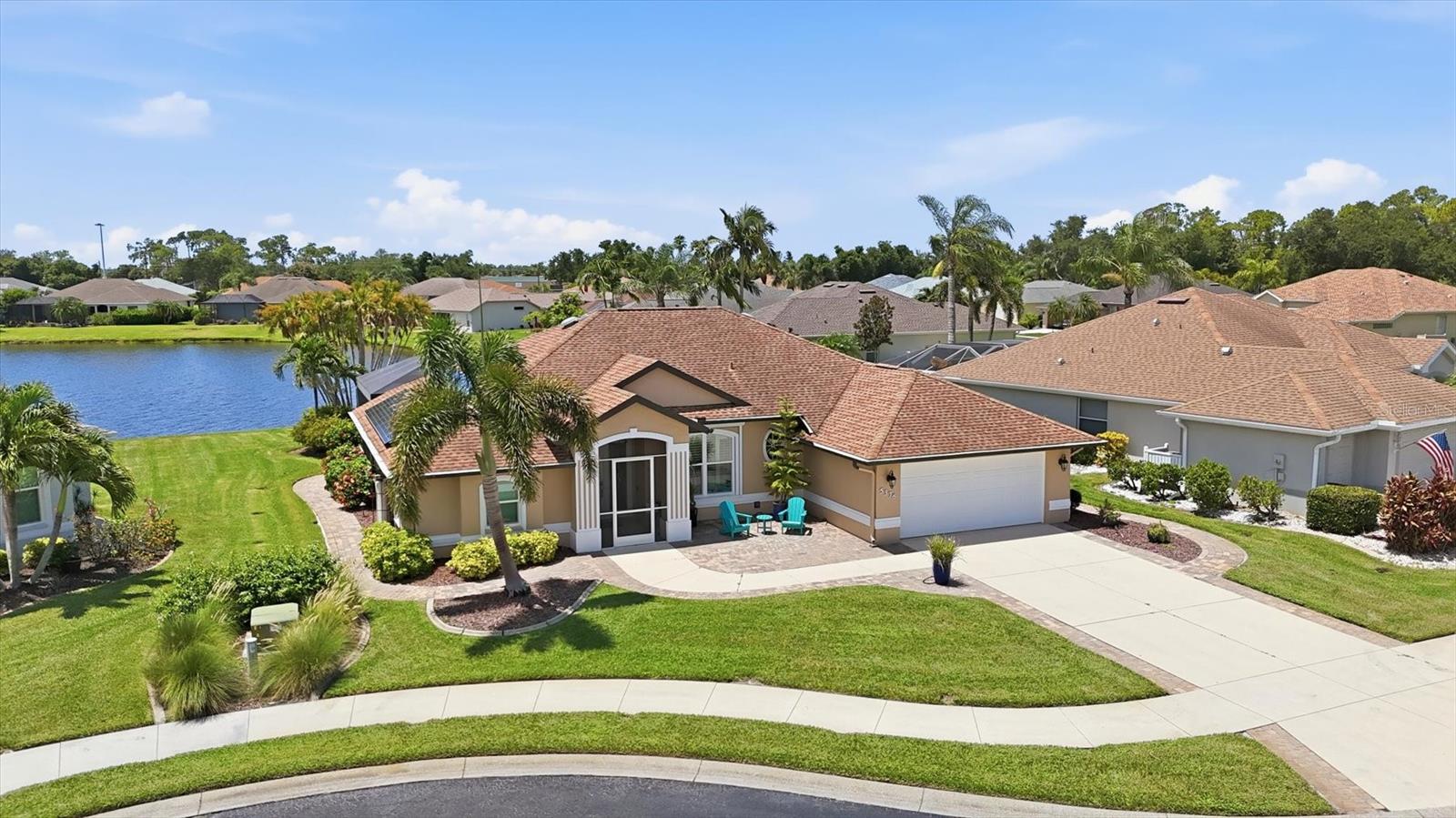 SABAL TRACE'S BEST-KEPT SECRET... NOW READY TO BE YOURS! 3 Bedroom | 2 Bath | Oversized ¼+ Acre Lakefront Homesite | Better Than New – Complete Luxury Transformation | Over $320,000 in Premium Improvements | Owned SunPower Solar System | Saltwater Solar-Heated Pool | Full Hurricane Protection | Gated Community | NO CDD | Low HOA! Welcome to one of Sabal Trace's finest waterfront residences, where timeless design, uncompromising craftsmanship, and thoughtfully curated improvements have created a home that truly lives better than new. Why wait to build when you can enjoy all the advantages of a professionally remodeled luxury home—without the construction delays, dust, disruption, surprise upgrade costs, or costly builder fees? Curb appeal is off the charts with tropical landscaping, paver driveway and walkways and the whole house shines bright with a fresh coat of SW Premium Paint. Step inside and you will know your search has come to an end.The view is amazing and everything feel fresh and new! From classic plantation shutters throughout and rich hardwood flooring to luxurious Arhaus lighting, designer finishes, and spa inspired baths, every detail has been thoughtfully selected to impress. The spectacular chef's kitchen is the heart of the home, showcasing custom creamy ivory cabinetry, a dramatic waterfall island, premium KitchenAid appliances, induction cooktop, built-in convection oven and microwave, designer backsplash, stainless hood, abundant storage, and an impressive 140-bottle wine refrigerator ready for effortless entertaining. The highly desirable split-bedroom floor plan offers exceptional privacy for family and guests while living beautifully beyond its 2,053 square feet, with an inviting family room, living room, and dining area all flowing seamlessly around the stunning lakefront lanai to create the light-filled, open-concept lifestyle today's buyers crave. The private primary wing is a true retreat featuring an expansive 21' x 13' owner's suite with room for a sitting area or home office, custom ELFA closet organization systems, and a luxurious spa-inspired ensuite complete with dual vanities, an elegant freestanding soaking tub, oversized walk-in multi-head shower, and premium TOTO Washlet. Pocketing sliding glass doors open to your private outdoor oasis where a panoramic picture-screen enclosure frames tranquil long lake views, abundant Florida birdlife, and a solar-heated saltwater pool designed for year-round enjoyment. Behind the scenes, you'll appreciate the value of an owned SunPower solar electric system, PGT impact windows & sliding doors, motorized hurricane shutters, NEW AC , REME UV whole-home air purification, New water heater, whole-house water softener, kitchen drinking water filtration, solar water heater, enhanced attic insulation with solar ventilation, Gorilla epoxy garage flooring, LED lighting, and a 50-amp RV hookup. Perfectly positioned just outside the gates of Heron Creek Golf & Country Club, championship golf is just moments away with public play & optional membership opportunities, while the new $507 million Sarasota Memorial Hospital North Port campus, Coco Plum Village Shops, Costco, vibrant Wellen Park, CoolToday Park, Atlanta Braves Spring Training, miles of scenic walking and biking trails, Gulf beaches, I-75, and regional airports are all conveniently nearby. Homes of this caliber rarely become available in Sabal Trace. Come discover why this truly is Sabal Trace's best-kept secret.