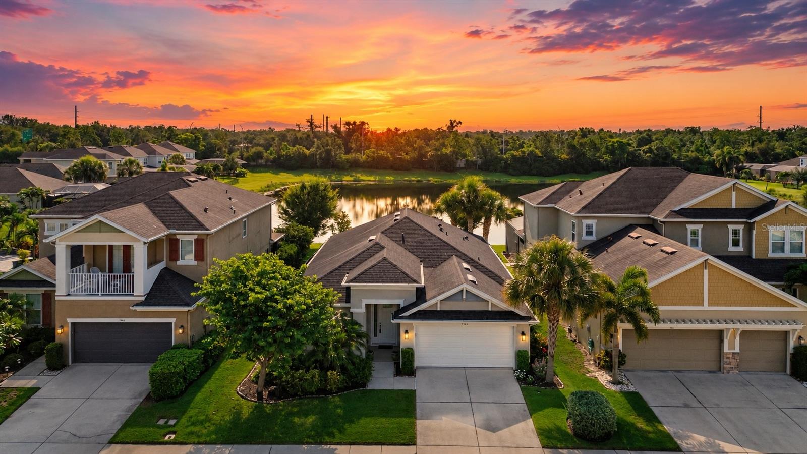 Perfectly positioned on one of the most desirable lakefront lots in Arbor Lakes on Palmer Ranch, this meticulously maintained residence offers breathtaking water views, exceptional upgrades and the Florida lifestyle buyers dream about. Offering 3 bedrooms, 2 bathrooms, a private office and 2,055 square feet of thoughtfully designed living space. This move-in ready home blends timeless elegance, everyday comfort and effortless indoor-outdoor living. From the moment you enter, you'll appreciate the soaring architectural ceilings, open-concept floor plan and a stunning rotunda that creates an elegant focal point and a welcoming first impression. Beautiful upgraded porcelain tile flooring flows seamlessly throughout the home and has also been upgraded to include the screened lanai, while updated LED lighting, designer light fixtures, accent walls, and stylish ceiling details create a sophisticated yet inviting atmosphere. The heart of the home is the spacious kitchen, featuring abundant granite countertop space with seating for four, stainless steel appliances, soft close cabinets and a premium Bosch dishwasher renowned for its whisper-quiet performance. The expansive three-panel sliding glass doors fully retract, seamlessly blending indoor and outdoor living while showcasing sweeping lake views and the beauty of Florida's native wildlife. The screened lanai overlooks a fully fenced backyard with plenty of room for a custom saltwater pool and is already plumbed and ready for an outdoor kitchen. An extended uncovered patio provides the perfect space for grilling, outdoor dining, lounging in the Florida sunshine or gathering around a future fire pit, creating an ideal setting for year-round entertaining. The spacious primary suite is a peaceful retreat featuring a tray ceiling, tranquil water views, two generous walk-in closets, a luxurious en-suite bath with dual vanities, a soaking tub and an oversized walk-in shower. Additional upgrades include a natural gas tankless water heater, Smart Home Connect Wi-Fi, hurricane shutters for the entire home, an in-wall pest control system and a natural gas connection already in place, offering flexibility to install a gas range if desired. Located in one of Sarasota's most sought-after communities, Arbor Lakes on Palmer Ranch offers low HOA fees, no CDD fees and has outstanding resort-style amenities including a community pool and spa, splash park, pirate-themed playground, basketball and volleyball courts, dog park, fishing lakes, pavilion and gas fire pit. Families will appreciate being zoned for the highly rated Skye Ranch K-8 School and Pine View School is only 4.9 miles away with bus service available. Just 6.3 miles from world-famous Siesta Key Beach and minutes from Legacy Trail, top-rated restaurants, shopping, downtown Sarasota, and I-75, this home offers the perfect combination of luxury, convenience, and an active Florida lifestyle. Rarely does a home with this combination of a premium lakefront location, thoughtful upgrades, top-rated schools, and exceptional community amenities become available. Don't miss the opportunity to make this beautiful Arbor Lakes residence your next home.