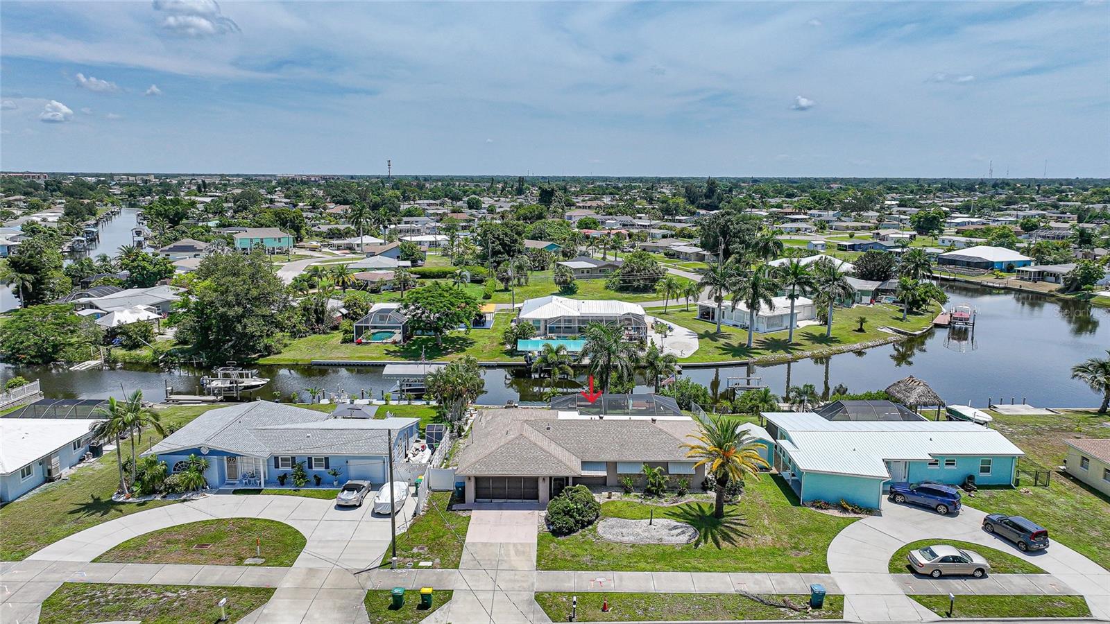 Enjoy the best of Florida waterfront living with this TURNKEY READY pool home, ideally situated just off the Sunrise Canal with quick saltwater access to Charlotte Harbor and the Gulf of Mexico. Boating and fishing are just moments from your private dock, complemented by stunning water views and abundant wildlife, including dolphins, manatees, otters, and a variety of birds. This spacious home offers 1,565 square feet of living space, featuring three bedrooms, two baths, an attached two-car garage, and a front screened patio. Inside, tile flooring runs throughout, with a living room, separate dining area, and a well-appointed kitchen showcasing cherry wood cabinetry with custom stained-glass accents, stainless steel appliances, and views overlooking the pool and lanai. A bright Florida room opens seamlessly to the screened pool area, complete with an outdoor shower, creating an ideal space for indoor-outdoor living and entertaining. The primary suite features sliding glass door access to the pool area and an attached bathroom with a walk-in shower, offering both comfort and convenience. Two nice-sized guest bedrooms with built-in closets share a bathroom with a walk-in shower, providing ample space for family or visitors.
Step outside to the patio and enjoy a unique life-size chess game, perfect for relaxing evenings and gathering with family and friends while taking in beautiful waterfront sunsets. The completed Edgewater Project has enhanced the neighborhood with updated water and sewer systems, storm drainage, fiber optics, sidewalks, and bike lanes. Conveniently located just a short walk or drive to Port Charlotte Beach, waterfront parks, shopping, dining, US-41, and Punta Gorda Airport, this home offers the ultimate Florida waterfront lifestyle. Your coastal retreat with great potential awaits. **PLEASE ENJOY THE 3D INTERACTIVE VIRTUAL TOUR ASSOCIATED WITH THIS LISTING**