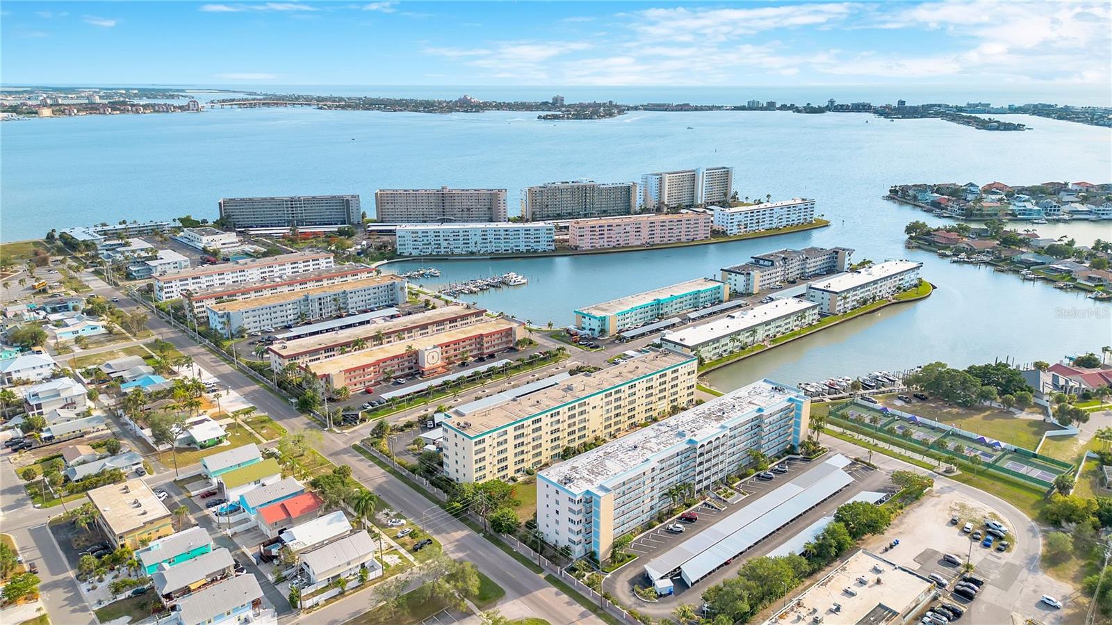 Modern coastal living awaits in this beautifully updated 2-bedroom, 2-bath residence offering 1,120 square feet in the highly sought-after waterfront community of Town Shores of Gulfport. This move-in ready condo combines stylish upgrades with comfort and convenience just moments from the vibrant Gulfport waterfront district. Inside, you'll find fresh interior paint, new luxury vinyl flooring, updated baseboards, and impact-rated windows throughout for added peace of mind and energy efficiency. The spacious primary suite features a fully remodeled en-suite bath with contemporary finishes and thoughtful design. The kitchen offers the convenience of rare gas cooking, making meal preparation a pleasure for home chefs and entertainers alike. The functional split-bedroom layout provides flexibility for guests, home office space, or seasonal living, while generous natural light enhances the inviting interior atmosphere. Relax and enjoy the Florida lifestyle from your private living spaces within this well-maintained waterfront community. Residents of Town Shores enjoy an extensive selection of amenities including multiple heated pools, tennis and pickleball courts, shuffleboard, clubhouse and social spaces, fitness opportunities, marina access, waterfront walking areas, and a wide variety of community activities and events. Located just blocks from downtown Gulfport, this home places you near local restaurants, coffee shops, art galleries, waterfront parks, Gulfport Beach, the marina, and popular community events. Convenient access to downtown St. Petersburg, area beaches, Tampa International Airport, and major commuter routes makes this an exceptional opportunity to enjoy the best of Florida Gulf Coast living. Whether you are seeking a full-time residence, seasonal retreat, or low-maintenance coastal property, this updated condo offers comfort, style, and an unbeatable location in one of Pinellas County’s most unique waterfront communities. Book your private showing today!