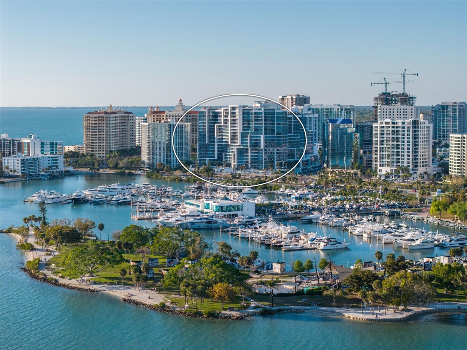 Indulge in Bayfront Luxury at The VUE, a landmark of modern luxury where worldly architecture meets the vibrant cultural allure of downtown Sarasota. Poised for effortless walkability, this home places you near fine dining, upscale boutiques, art galleries, performing arts venues, and the renowned Saturday farmers market. Savor sweeping, unobstructed vistas of Sarasota Bay, Marina Jack and the Gulf of Mexico. Upon arrival, the elevator opens directly into your residence's private, dedicated foyer. As you then continue through the front entry door, you are immediately drawn to the dramatic expanse of 10-foot, floor-to-ceiling impact-rated glass that frames breathtaking water views and floods the open-concept interior with abundant natural light. This exquisitely refined residence features two bedrooms and two and a half baths, among 2,040 heated square feet and 2,250 total square feet. Designed with grand entertaining and quiet retreat in mind, the spacious living and dining areas flow gracefully onto a generous private terrace with mesmerizing water views, an ideal setting for evening cocktails as the sun dips into the horizon. The chef’s kitchen is a masterclass in contemporary elegance, featuring quartz countertops, a waterfall island with breakfast bar, premium stainless-steel appliances, induction cooktop and bespoke Nolte Kitchen European cabinetry, crafted to inspire culinary creativity and conversation alike. The owner’s suite is a tranquil sanctuary, complete with breathtaking bay views, custom-designed closets and a spa-like en-suite bath with dual vanities, soaking tub and glass enclosed walk-in shower. A split-bedroom layout ensures the utmost privacy for guests, with a secondary en-suite bedroom positioned thoughtfully on the opposite side. Additionally, a den/office with a built- in pocket door, may also be used as a third bedroom or other flexible living options, such as a library or media lounge. With abundant natural light, it can even serve as an inspiring artist’s studio. Additional features include LED lighting, premium designer finishes and fixtures, and motorized shades ensure seamless comfort. A dedicated, spacious walk-in laundry room with ample storage and cabinetry and a side-by-side washer and dryer. There are two secure garage parking spaces, one is premium plaza level, near entry/exit gate to parking, two is valet level EV personalized/dedicated to unit and climate-controlled storage unit. Residents will enjoy a collection of exceptional lifestyle amenities. Indulge in the elevated resort-style pool and spa with private cabanas, unwind at one of two rooftop dog parks with a grooming station, or maintain your wellness regimen at the state-of-the-art fitness center overlooking the pool. The residents’ club lounge, complete with a catering kitchen and entertainment bar, sets the stage for elegant gatherings, while the boardroom and social lounges provide thoughtful spaces to work or unwind. Additional offerings include a fire pit with dual gas grills, valet parking, 24-hour concierge service, exceptional onsite management and attentive on-site staff devoted to providing a seamless living experience. Positioned just moments from Sarasota’s world-class beaches, including Lido Key. This iconic residence offers a rare blend of urban sophistication and coastal tranquility. Whether you’re seeking a seasonal escape or a full-time waterfront haven, delivering a lifestyle of elegance and convenience without parallel.