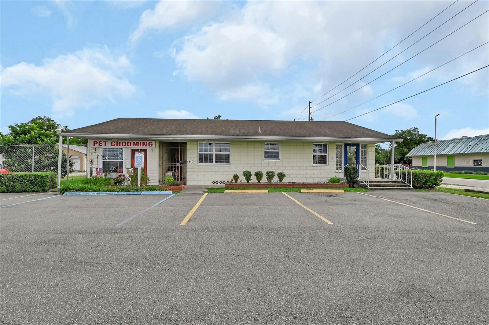 Great DeLand Commercial property with prime corner location on busy S Woodland Blvd location. Very visible. Currently leased to two tenants. This is a Versatile property has three separate buildings within the fully fenced corner lot. Zoned C2
One building currently accommodates two tenants and provides them with excellent customer parking.  The other two buildings are comprised of a large dual warehouse with carport attached plus there is an auxiliary studio building works well as a small office and has one full bath.  This Studio has a connecting carport as well.  Coming and going vehicles have great ingress and egress through two large gates that allow traffic to flow through in a circular pattern. Back of the lot is Fully fenced which creates a compound arrangement that’s great for securing work vehicles and materials after hours. Same owner for over 50 years!