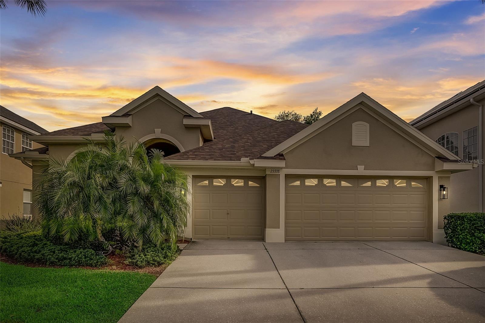 Nestled within the highly sought-after gated community of Plantation Palms, this beautiful high quality renovated residence delivers an exceptional blend of comfort, style, and entertaining-ready living,  all set against serene golf course views.
The home's open floor plan creates an effortless flow from front to back. Arrive into a formal living and dining area anchored by elegant crown molding, then pass through a graceful archway into the showstopping gourmet kitchen — featuring rich wood cabinetry, striking quartz countertops, a prep island, and a dramatic waterfall quartz island that serves as the true centerpiece of the home. The kitchen opens seamlessly into a generous family room, where natural light pours in and a sliding glass door leads to your screened lanai overlooking the golf course. 
The split floor plan offers privacy and flexibility. The primary suite anchors one side of the home and features two walk-in closets, dual vanities, a garden tub, and a large walk-in shower. On the opposite wing, you'll find a versatile office/hangout space, two additional bedrooms, and in the back of the home, full bath ideal for guests, or work from home space. Zoned for top-rated schools and located within half a mile of the Land O' Lakes Recreation Center — baseball, football, soccer, tennis, competitive swimming, skateboarding, and a dog park all within reach. Minutes to Tampa Premium Outlets, dining, I-75, I-275, and the Veterans Expressway.
As a resident of Plantation Palms, enjoy access to an 18-hole championship golf course, lighted driving range, Mulligan's Pub, and miniature golf all within the community gates. Recent renovations include, AC 2022, Roof 2023, bathrooms, kitchen.
