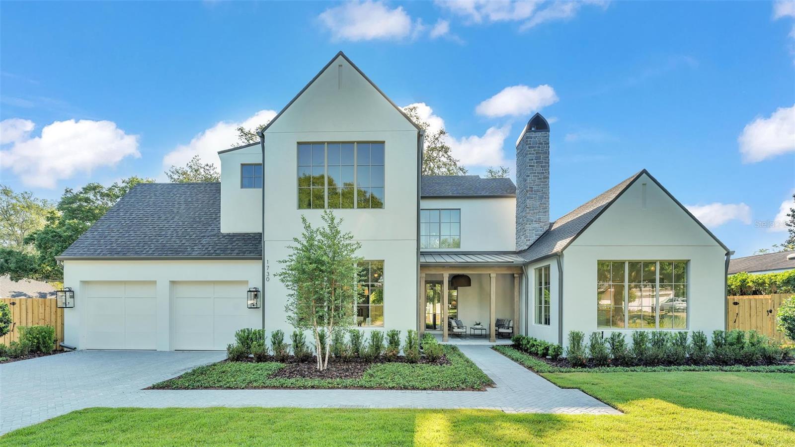 Welcome to this exquisite 5-bedroom, 5.5-bathroom home built by Lundev, perfectly situated in the highly sought-after Timberlane Shores neighborhood of Winter Park. Spanning 4,080 square feet, this property offers the ultimate blend of luxury and comfort. Thoughtfully designed for both entertaining and everyday living, this home features high-end finishes and top-quality craftsmanship throughout.

Upon entering, you're greeted by a charming front porch with a cozy fireplace, setting the tone for the warmth and elegance that continues inside. This inviting outdoor space is perfect for relaxing with a morning coffee or enjoying cool evenings with friends and family. Step inside to find a spacious great room, ideal for gathering and entertaining, boasting ample natural light and a seamless flow to the rest of the home’s main living areas.

The gourmet kitchen is a chef’s dream, boasting high-quality appliances, a wine cooler, refrigerator drawers, and a casual café area for everyday dining. The adjacent formal dining room offers a sophisticated space for hosting elegant dinner parties and holiday gatherings. These thoughtfully designed spaces ensure that every meal and event is special.

The luxurious primary suite is conveniently located on the first floor, providing a tranquil retreat with easy access. It features a spa-like bathroom with double sinks, a soaking tub, a shower, a linen closet, and a large walk-in wardrobe for ample storage. Additionally, on the main floor you will also find a detached bedroom or office with an en-suite bathroom, built-in closet, and private entrance offering flexibility and making it ideal for guests or as a private workspace.

Upstairs, you’ll find three aditional bedrooms, each featuring its own en-suite bathroom and walk-in closet, providing comfort and privacy for all occupants. A versatile loft/den area on the second floor adds extra living space, perfect for a home office, playroom, or relaxation area, catering to various lifestyle needs.

The outdoor area is an entertainer's paradise, complete with a private pool & spa, a cabana with a pleasant fireplace, and a summer kitchen for alfresco dining and entertaining. Whether hosting a barbecue or enjoying a quiet afternoon by the pool, this space is designed for relaxation and enjoyment. With its great location, this home offers excellent proximity to Blue Jacket Park, Baldwin Park, and the vibrant Park Avenue, known for its entertainment options, shops, and restaurants. Experience luxury living in one of Winter Park's most coveted areas. Schedule your private tour today to see this stunning property in person!