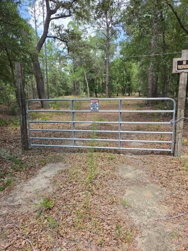 Discover the potential of this beautiful homesite in Citrus Springs. This partially cleared parcel offers a great head start for your future home while still providing natural surroundings for added privacy. The property features front fencing, making it ideal for defining the entrance and enhancing curb appeal. Conveniently situated near shopping, dining, schools, golf courses, parks, the scenic Withlacoochee State Trail, and the area's famous springs and rivers, you'll enjoy both peaceful living and easy access to everyday conveniences. With no HOA and plenty of room to bring your vision to life, this is an excellent opportunity to build your dream home or invest in one of Citrus County's communities. Don't miss your chance to own a piece of Florida's Nature Coast!
Buyer and buyer's agent should verify all property information, zoning, utility availability, and intended use with the county.