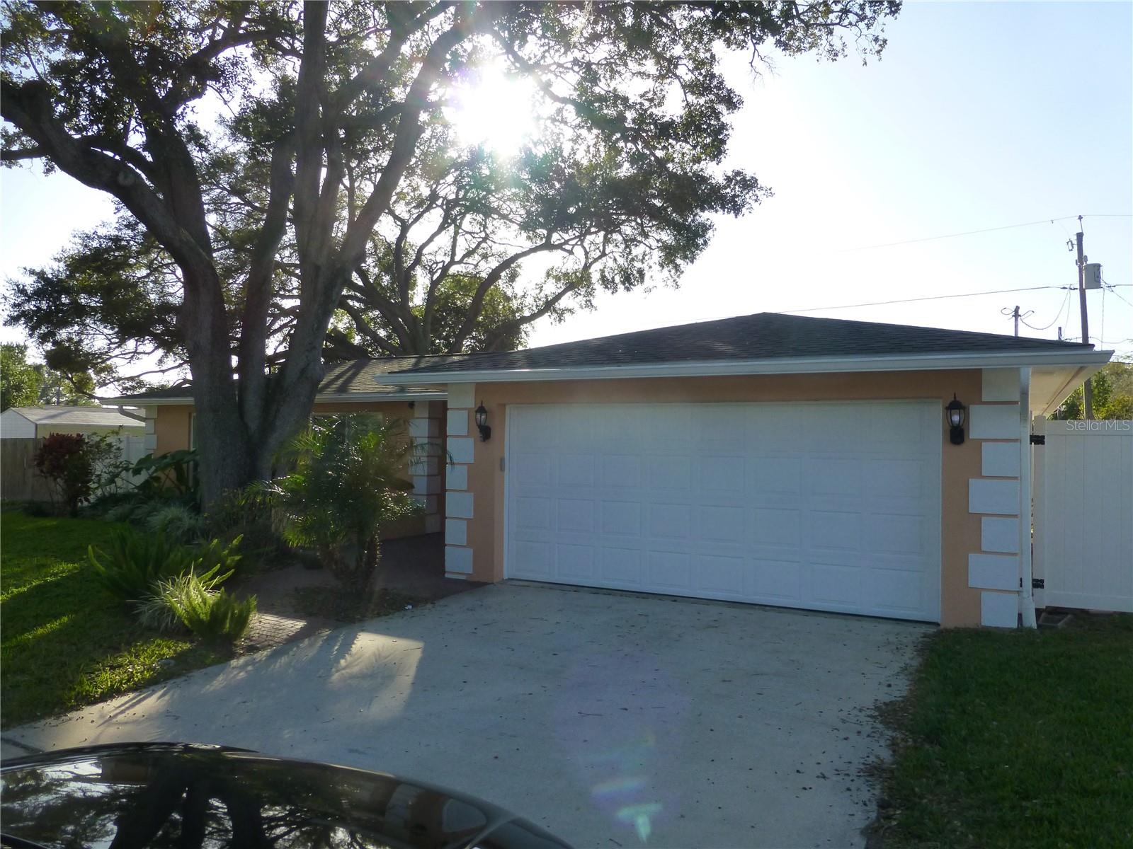 Welcome home to this well-maintained 3-bedroom, 2-bathroom home with a 2-car garage in a desirable Dunedin location! This inviting residence offers a spacious layout designed for comfortable everyday living.

Step outside to enjoy a large open patio overlooking a private, fully fenced backyard shaded by beautiful mature trees—an ideal setting for relaxing, entertaining, or enjoying Florida's year-round sunshine.

Conveniently located with a straight shot to vibrant Downtown Dunedin, you'll be just minutes from award-winning restaurants, boutique shopping, breweries, waterfront parks, the Pinellas Trail, and countless community events. Enjoy easy access to nearby beaches, golf courses, and major roadways while living in one of Tampa Bay's most sought-after communities.

Don't miss this opportunity to lease a home that combines privacy, comfort, and an unbeatable Dunedin location.