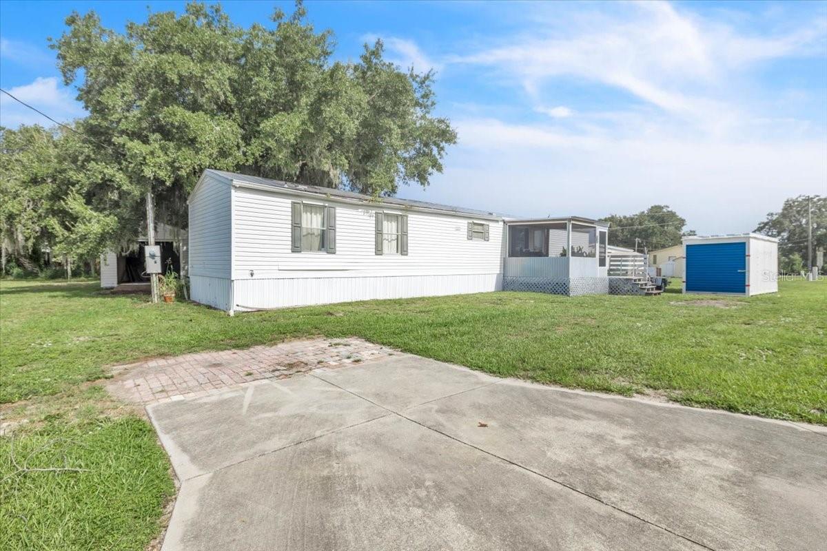 Enjoy the best of Florida living in Peace River Mobile Home Park in Punta Gorda with this 2006 single-wide manufactured home situated on a spacious oversized pie-shaped lot with no HOA fees and NOT IN A FLOOD ZONE. Perfectly located for boating enthusiasts, this property offers convenient access to a nearby boat ramp with a quick route to the Peace River, Charlotte Harbor, and the Gulf of Mexico. This comfortable 2-bedroom, 2-bath home features a spacious living and dining area with the kitchen overlooking the main living space, creating an open and functional layout. The kitchen includes a new stainless-steel refrigerator and provides a great setup for everyday living and entertaining. The home also features vinyl flooring throughout, inside laundry, and central air conditioning and heat. The thoughtfully designed split-bedroom layout provides privacy, with the primary bedroom located on one side of the home featuring a walk-in closet and an attached bathroom with a walk-in shower. The guest bedroom is located on the opposite side of the home and offers a built-in closet along with convenient access to its own bathroom. Enjoy Florida’s outdoor lifestyle with a 12x24 screened-in back deck featuring durable aluminum beams overlooking the backyard, plus a screened-in front porch perfect for relaxing and enjoying the peaceful surroundings. A detached 20x30 storage shed provides ample space for tools, hobbies, a workshop area, or outdoor equipment. Located near the popular Peace River Fish Camp and just a short drive to historic Downtown Punta Gorda, where you’ll find waterfront dining, shopping, parks, festivals, and entertainment. With boating access nearby and the charm of Punta Gorda just minutes away, this is a wonderful opportunity to enjoy an affordable Florida lifestyle in a desirable location.
**PLEASE ENJOY THE 3D INTERACTIVE VIRTUAL TOUR ASSOCIATED WITH THIS LISTING**