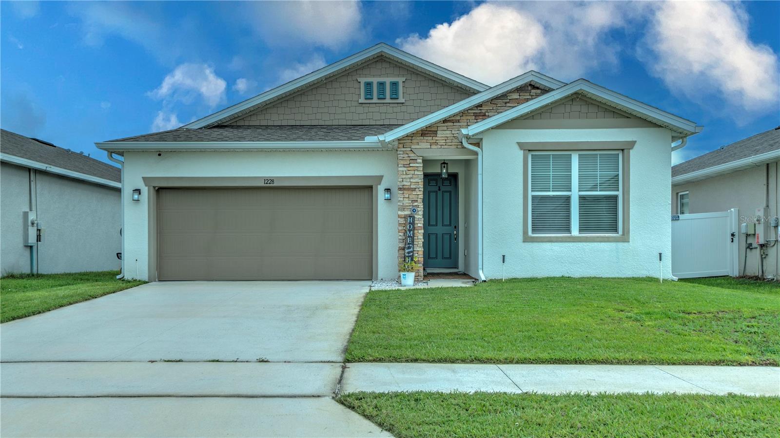 MOTIVATED SELLER! Welcome to this better-than-new home in the desirable Mattie Pointe community! 

This beautifully upgraded 4-bedroom, 3-full-bathroom home offering 2,325 Sq. Ft. combines modern design, comfort, and functionality. Featuring a private in-law suite, this home is perfect for guests, multigenerational living, a home office, or additional privacy.

The heart of the home is the stunning designer kitchen, showcasing a large quartz island, custom gold faucets and hardware, upgraded cabinetry, and an open-concept layout designed for entertaining and everyday living.

Premium Upgrades Throughout Include:

 Luxury flooring throughout the entire home — NO carpet
Whole-home water filtration system providing clean drinking water from every faucet
Upgraded HVAC system with built-in UV air purification technology designed to improve indoor air quality
Generator-ready electrical connection for convenient backup power capability
Ceiling fans installed throughout bedrooms, family room, and screened lanai for added comfort and efficiency
Fully fenced backyard offering privacy and peace of mind
Screened lanai perfect for enjoying Florida’s beautiful weather year-round
?? Extended paver patio ideal for outdoor gatherings and entertaining
?? Gutters installed around the entire home
?? Overhead garage storage racks for maximum organization

Community Highlights:
Located in the sought-after Mattie Pointe community, featuring a low HOA of only $42/month, a community playground, and convenient access to shopping, dining, schools, Lakeland, and Orlando.

Why wait for new construction when you can own a home that already includes thousands of dollars in upgrades? This move-in ready property offers the benefits of a new home without the wait or additional upgrade costs. 

Schedule your private showing today — this exceptional home is ready for its next owner!
