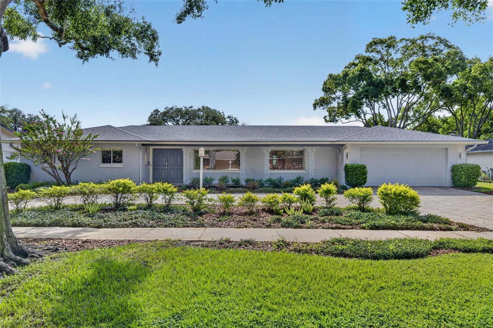 Perfectly positioned on the 8th tee and 9th hole of the Winter Park Pines Golf Course, this home sits on an oversized quarter-acre lot and offers a rare opportunity to create your dream home while enjoying breathtaking golf course views.  **The current floor plan features three bedrooms, as the original fourth bedroom has been converted into an expansive walk-in closet for the primary suite, and the flexible layout also offers the potential for a fifth bedroom.**
While the interior offers an exciting opportunity to update, the sellers have already completed nearly $190,000 in major infrastructure and system improvements. One of the home's most valuable features is the fully paid-off solar panel system, which generates excess electricity that is returned to the Winter Park power grid, resulting in an average monthly electric bill of approximately $50.
Additional capital improvements include a newer roof (2021), a new high-efficiency, variable-speed Lennox HVAC system (2025), a new energy-efficient, heat-pump water heater (2025), complete home repipe (2020), restoration of the cast-iron sewer system (2022) and plumbing stacks, upgraded attic insulation for enhanced energy efficiency (2023), a newer pool heater and pump (2024), added French drains (2025), new gutters with leaf guards, a deep irrigation well, an expanded circular paver driveway for ample parking space, and much more.
Inside, the flexible floor plan offers endless possibilities. Beyond the spacious, front-facing living/dining room, the kitchen opens to a comfortable family room with a wood-burning fireplace. The kitchen window and pocket sliding glass doors frame beautiful views of the expansive covered lanai, screened pool, and rolling fairways beyond.
The current 3-bedroom/2-bath layout on the left side can easily be reconfigured to restore the original 4th bedroom, which now serves as an oversized walk-in closet for the primary suite. The corner bedroom functions as both a guest room and home office, featuring a custom Murphy bed concealed behind a built-in bookcase, providing exceptional flexibility.
On the opposite side of the home, an enormous bonus room with a full bath, offers direct pool access, and sweeping golf course views. Whether envisioned as a private guest suite or 5th bedroom, recreation room, home office, fitness studio, media room, or multigenerational living space, the bonus room has endless possibilities. 
Located just a few doors from the Cady Way Trail on one of the neighborhood's most picturesque oak-canopied streets, the setting is truly exceptional.  This is a rare opportunity to purchase a home set directly on one of Winter Park's premier golf courses, where major mechanical system upgrades and costly infrastructure improvements have already been completed, creating the perfect opportunity to transform the interior into your own custom vision. Move in today, enjoy the exceptional location, and renovate at your own pace!
Be sure to request a complete list of improvements, along with the floor plan, to fully appreciate the incredible potential this home presents.