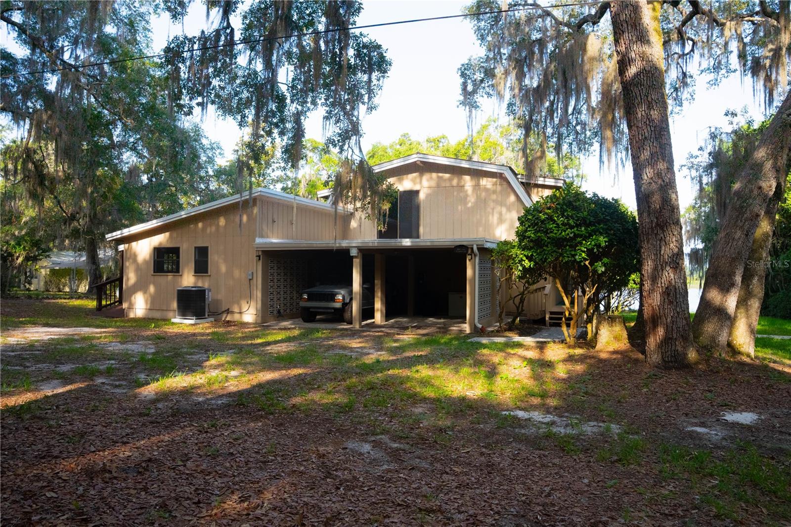 Experience the perfect blend of country living and modern convenience with this exceptional lakefront property offering breathtaking water views and outstanding privacy. Situated on a peaceful homesite, this spacious 4-bedroom, 3-bathroom home provides plenty of room for family, guests, or a home office.
Relax on the inviting porch while taking in the picturesque lake views and peaceful surroundings, or entertain family and friends in the spacious outdoor living areas. A detached studio offers flexible space for a home office, art studio, fitness room, or guest retreat. The property also includes two storage sheds, providing ample room for tools, equipment, and outdoor equipment, while a whole-home generator provides dependable backup power for added peace of mind.
Whether you're searching for a full-time residence or a private country retreat, this unique lakefront property offers the perfect combination of space, privacy, scenic beauty, and versatility. Enjoy the tranquility of waterfront living while still having the comforts and conveniences of home. Don't miss this rare opportunity to own your own slice of paradise.