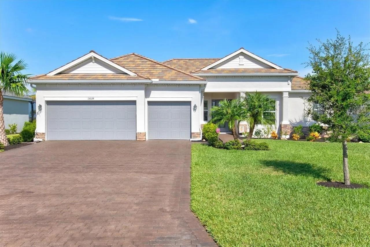 Tucked behind the gates of Harbor West, this exceptional waterfront residence delivers the kind of Southwest Florida lifestyle most buyers spend years searching for. Built in 2020 and positioned on an oversized canal-front homesite with direct Gulf access, this custom-designed 4-bedroom, 2.5-bath home blends modern coastal luxury with true boating convenience. From the moment you enter, the attention to detail is unmistakable — soaring ceilings, crown molding, coffered and tray ceiling accents, designer finishes, expansive impact windows, and an open split-bedroom floorplan designed to maximize both privacy and water views.

The heart of the home is a beautifully appointed chef’s kitchen overlooking the spacious great room and waterfront backdrop, complete with premium appliances, custom cabinetry, wine refrigeration, and generous entertaining space. Large sliding glass doors create seamless indoor-outdoor living, allowing the main living areas to flow effortlessly toward the lanai and waterfront setting. Whether hosting guests, enjoying sunset dinners, or heading out for a day on the water, this property was designed around the Florida coastal lifestyle.

The oversized 3-car garage provides ample room for vehicles, storage, and recreational equipment, while the spacious lot offers a level of openness and privacy rarely found in newer waterfront communities. Enjoy quick boating access to Charlotte Harbor and the Gulf, with world-class fishing, island hopping, waterfront dining, and the beaches of Boca Grande all nearby.

Harbor West is one of the area’s most desirable gated waterfront communities, offering a peaceful residential atmosphere while remaining conveniently close to shopping, restaurants, golf courses, marinas, and everyday amenities. HOA permits leasing with 30-day minimum terms, making this property attractive both as a primary residence and as a potential seasonal or investment property.

A rare opportunity to own a newer luxury waterfront home that combines quality construction, elegant finishes, Gulf-access boating, and an unbeatable coastal location.