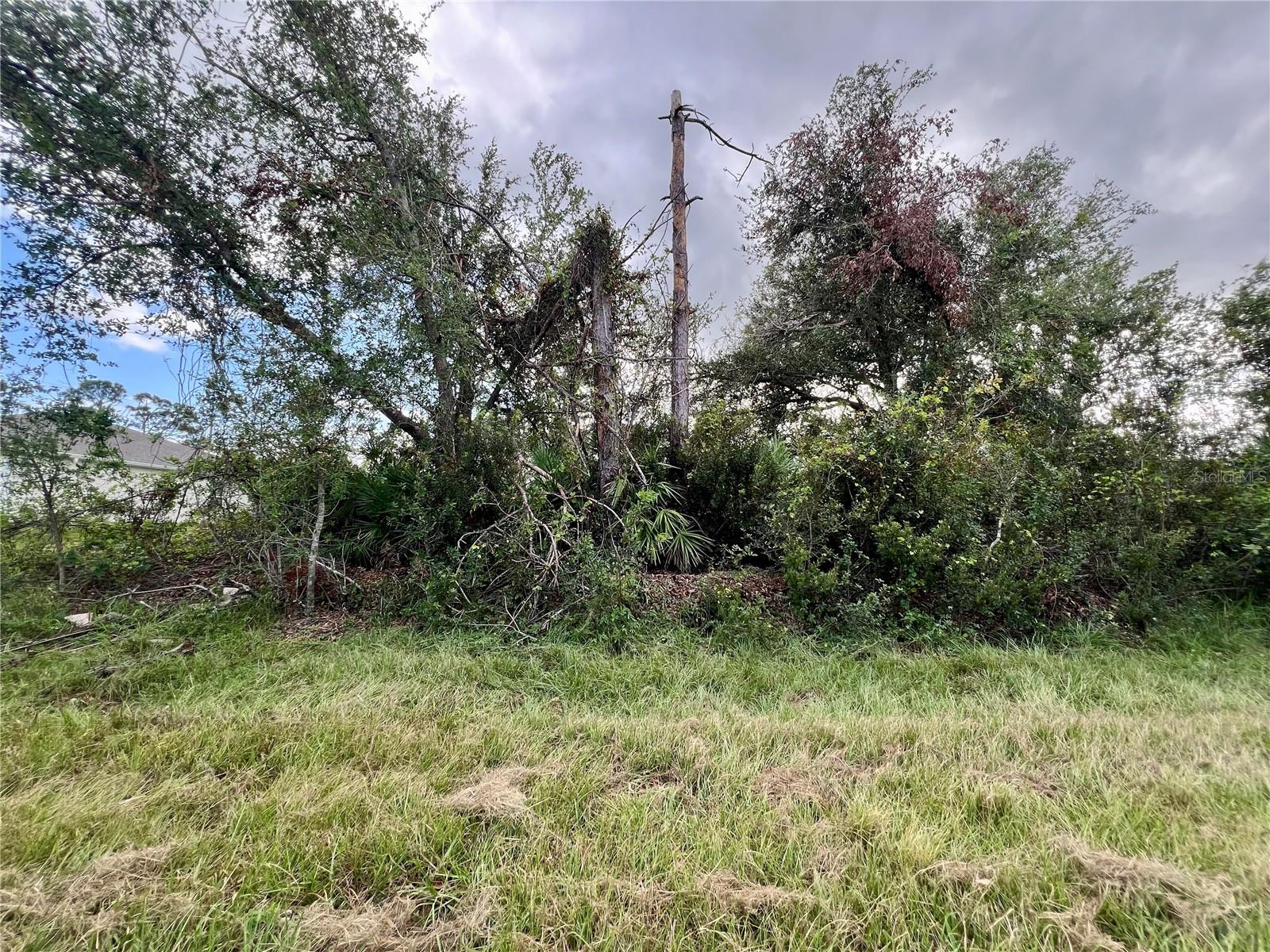 Beautiful lot offers a unique opportunity to build the home of your dreams, Situated in the Gulf Cove area of Port Charlotte a quiet area, this land boasts panoramic views and is in a convenient location close to local amenities. With ample space to design and build, this lot is perfect for those looking to create their own personal paradise. Wonderful opportunity to build your 'Old Florida' style home. Fishing, boating, kayaking, golfing throughout the year. Don't miss the chance to turn this land into your HOME!! This is a Voluntary HOA property.