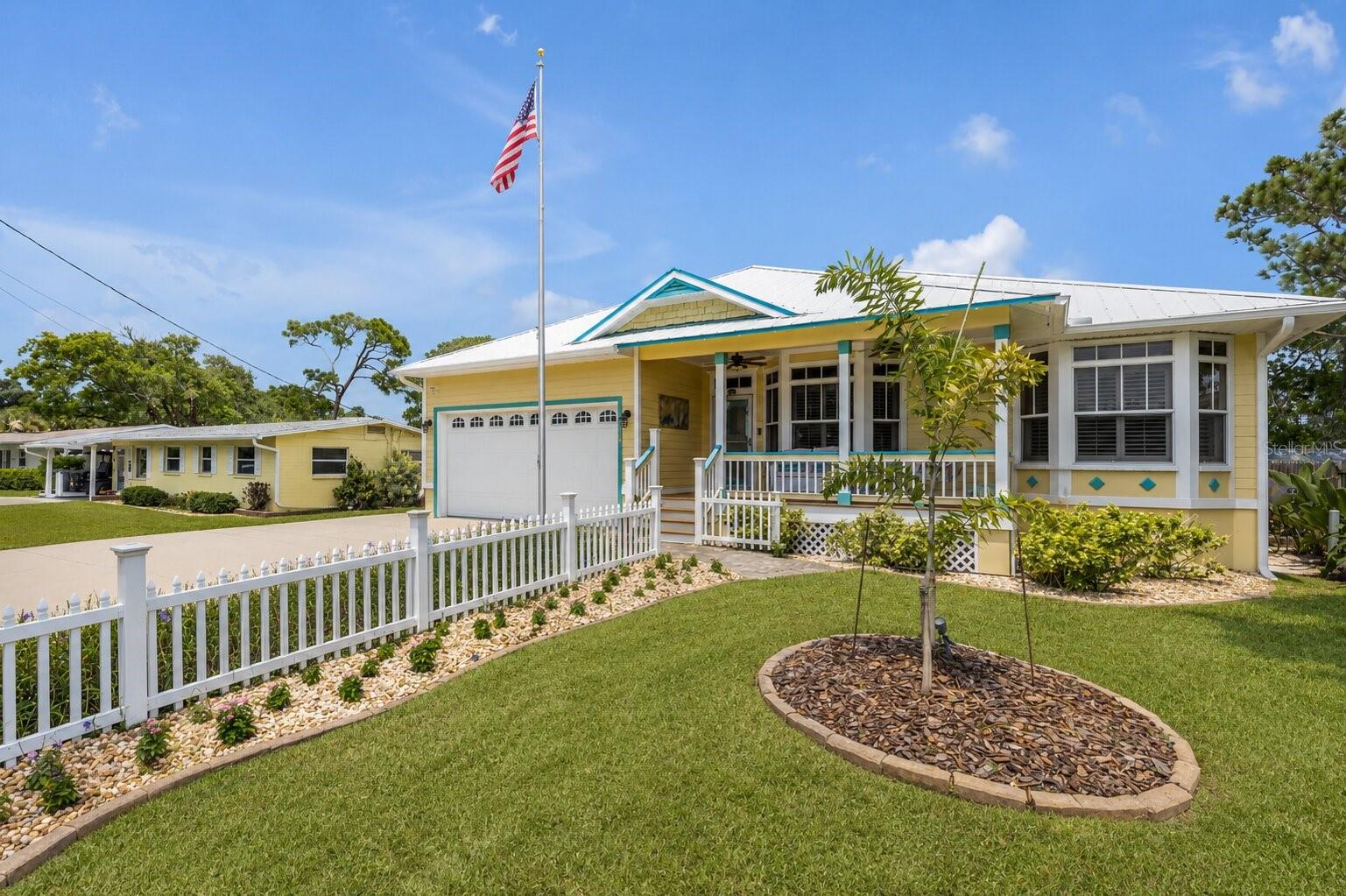 Welcome to your own slice of coastal paradise, where luxury, comfort, and the laid-back
charm of beachside living come together beautifully. Ideally located between the lively
atmosphere of Flagler Avenue—with its beach access, restaurants, and
entertainment—and the local historic charm of Canal Street, this exceptional home
places the very best of New Smyrna Beach right at your doorstep. Spend your days
exploring boutique shops, dining at local favorites, cruising by golf cart, or enjoying a
sunset bike ride through one of the area’s most sought-after
neighborhoods.  Thoughtfully crafted by Hickson Construction, this custom-built, owner
designed, raised slab-on-grade, residence offers quality craftsmanship and an
impressive collection of upgrades designed for both everyday comfort and effortless
entertaining. The heart of the home is a chef-inspired kitchen featuring premium Bosch
appliances, a gas cooktop, Viking exhaust hood, Insta-hot faucet, pot filler, farmhouse
sink, two closet type pantries, spacious center island, and breakfast bar—perfect for
gathering with family and friends.  All plumbing fixtures are premium units that were
over a $13,000.00 upgrade over the builder’s construction allowance. Inside, you’ll find
rich hardwood flooring, a stunning natural gas stone fireplace, plantation shutters
throughout, crown molding, volume and tray ceilings, built-in speakers, custom lighting,
and countless architectural details throughout. The two separate 18-month-old
Mitsubishi ducted mini-split inverter A/C units feature UV lights for sanitation. The
spacious owner’s suite provides a private retreat with a jetted garden tub, dual vanities,
and spa-like ambiance. Additional features include a whole-house, lighting arrestor,
surge protector, centralized UPS battery bank with dedicated outlets throughout the
house for sensitive equipment as well as a natural gas whole house generator, central
vacuum system, tankless gas water heater, security/camera system, storm shutters,
abundant storage, a climate-controlled attic space, and an enclosed porch complete
with A/C, beverage cooler, and TV hookup.  This area was included in the living
area.  Step outside and discover a true nature-preserve-type backyard oasis
overlooking a peaceful pond. Designed for year-round enjoyment, the resort-style
outdoor living area features a tiki hut with outdoor kitchen and bar, natural gas grill,
firepit, gas tiki torches, spa, wood decking, TV hookup, and beautifully illuminated
tropical landscaping. Whether you’re hosting guests or unwinding after a day at the
beach, this private retreat offers the perfect setting.  Outdoor enthusiasts will appreciate
the outdoor shower, kayak launch area, brick pavers, irrigation system, expanded
parking for an RV or boat, 30-amp &amp; sewer RV hookups, hardware for air compressor
station and elevated construction under the porch design providing ample space for
recreational toys and storage.  Listen to the sounds of the ocean from your very own
waterfront backyard and catch one of the frequent rocket launches that light up the night
sky.  This immaculate well-kept one-of-a-kind home captures the very essence of
Florida coastal living—where every day feels like a vacation and every detail has been
thoughtfully designed to enhance your lifestyle.  Property may be under audio and/or video surveillance.