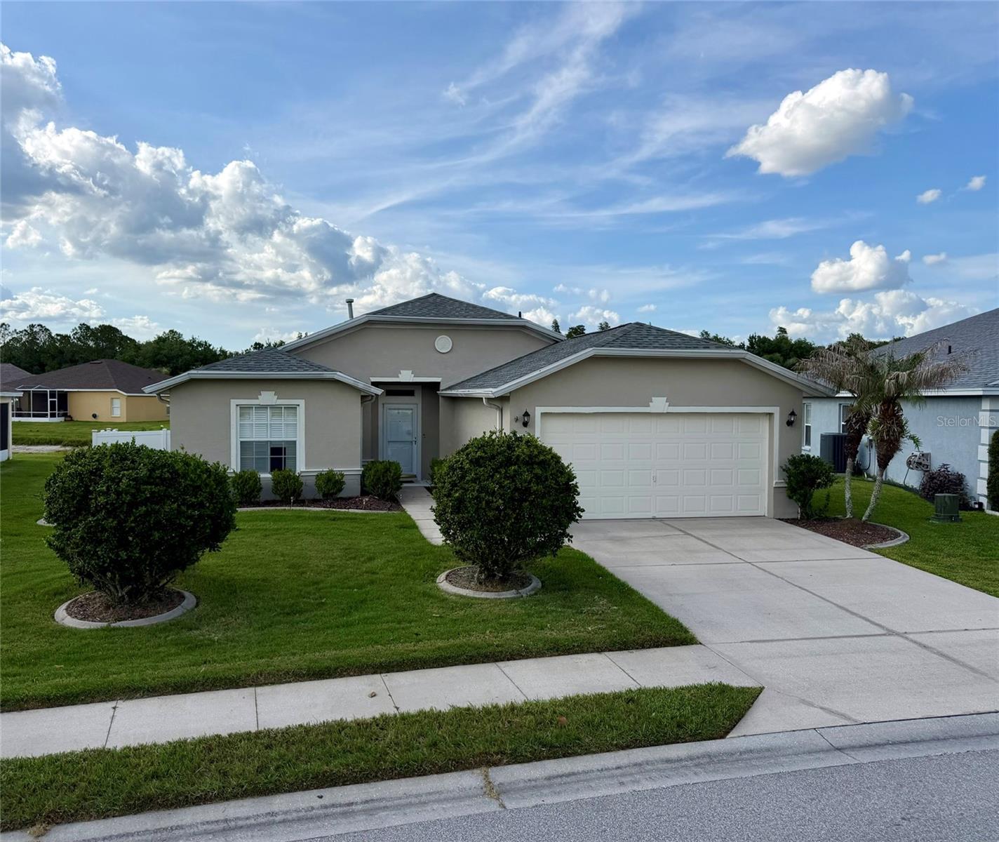 WELCOME TO CARILLON LAKES! THIS AWESOME GATED AND MAINTENANCE FREE COMMUNITY HAS IT ALL! BEGINNING WITH A 24 HR GUARD AT THE GATE! THE LOW HOA FEE COVERS LAWN CARE, CABLE AND INTERNET AS WELL AS THE INCREDIBLE IMENITIES PROVIDED. THE AMENITIES ARE IMPRESSIVE STARTING WITH THE LAKES AND PAVED WALKING AND BIKING PATHS THROUGHOUT THE COMMUNITY, A HUGE RESORT-STYLE POOL AND SPA, CLUBHOUSE, PLAYGROUND, GAZEBO, TENNIS, PICKLEBALL AND BASKETBALL COURTS, BILLIARDS ROOM, ARTS AND CRAFTS ROOM, LIBRARY, AS WELL AS MANY PLANNED EVENTS AND ACTIVITIES ALL YEAR LONG! NOW A LITTLE ABOUT THIS GREAT, TASTEFULLY UPDATED, SPLIT 3 BEDROOM, 2 BATH HOME. THE MAJOR UPDATES INCLUDE THE ROOF AND AC BOTH REPLACED IN 2022! INTERIOR AND EXTERIOR PAINT, UNIFORM FLOORING, GRANITE COUNTERS IN BOTH THE KITCHEN AND BATHS AS WELL AS THE FIXTURES, MAKES THIS AN ABSOLUTELY MOVE IN READY HOME! OFFERING BOTH A FAMILY AND A LIVING ROOM THAT OPENS UP TO THE SCREENED IN PATIO WITH WATERVIEWS! PERFECT FOR GRILLING OUT AND ENTERTAINING FAMILY AND FRIENDS! ALSO, YOU WILL APPRICIATE THE RECENTLY INSTALLED VINYL FENCE! CALL TODAY AND RESERVE YOUR OWN PRIVATE SHOWING OF THIS INCREDIBLE HOME AND ALL THE COMMUNITY HAS TO PROVIDE!