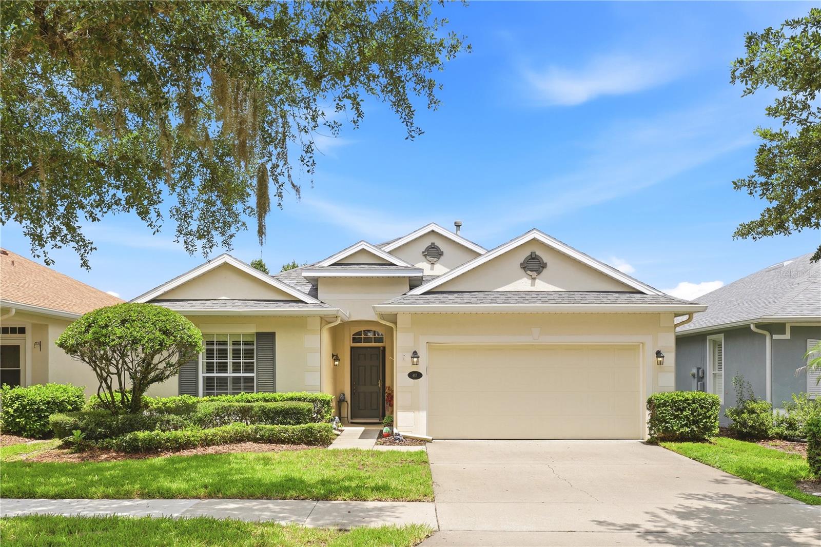 Welcome to Victoria Gardens, a sought-after 24-hour gated 55+ golf cart community in Deland offering an active lifestyle and low-maintenance living. This well-maintained single-story residence features two bedrooms, two baths, a dedicated office and a two-car garage, ideally positioned on a premium homesite with peaceful conservation views. Inside, you'll find beautiful oak hardwood flooring, tray ceilings, plantation shutters, custom built-in shelving and a gas fireplace that creates a warm and inviting living space. The spacious primary suite offers a large walk-in closet with a California Closet organization system, dual granite vanities, a glass-enclosed walk-in shower and a relaxing soaking tub. The guest bedroom and full bath are situated toward the front of the home, providing privacy for visitors, while the dedicated office offers flexibility for working from home, hobbies or a reading room. The kitchen features ample cabinetry, a pantry and a bright breakfast area, with the laundry room conveniently located nearby. Enjoy Florida's year-round outdoor lifestyle from the screened lanai overlooking the conservation area. The fenced backyard provides additional privacy and a serene setting for morning coffee or evening relaxation. Victoria Gardens residents enjoy access to private community amenities, including a clubhouse, restaurant, resort-style pool, fitness center, tennis courts, paths and gathering spaces designed to support an active and social lifestyle. Every evening, unwind on the back lanai and take in spectacular sunset views as the sky transforms into a breathtaking display of color, a perfect way to end each day. The HOA includes gated entry, lawn maintenance, Spectrum cable TV and internet and reclaimed water for irrigation. Conveniently located approximately 15 minutes from historic downtown Deland, this home also offers easy access to major roadways, area beaches, Orlando and three international airports, making it an excellent choice for both full-time and seasonal residents. Across the street from an 18-hole championship golf course! Schedule your private showing today and discover the lifestyle that awaits in Victoria Gardens.