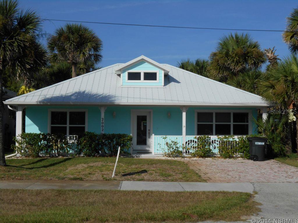 Immaculate 3 bed/2 bath beachside pool home on the West side of A1A. The Atlantic Ocean is steps from the front door. Large front porch. Spacious living space with an open floor plan, eat-in kitchen with breakfast bar, gas range, and double sliders leading to the back patio, pool and spa. Split bedrooms with the master suite at the rear of the home and the two guest rooms off the front. Master suite boasts a large walk-in California closet plus an additional closet with built-ins. The master bath has double sinks and vanities and a spacious walk-in shower. From the master bedroom the tropical backyard and pool can be enjoyed through the set of sliding doors which offer private patio access. Home also has a great utility room with a sink, storage shelving and cabinets plus newer-model front loading washer/dryer set. ;Water: City